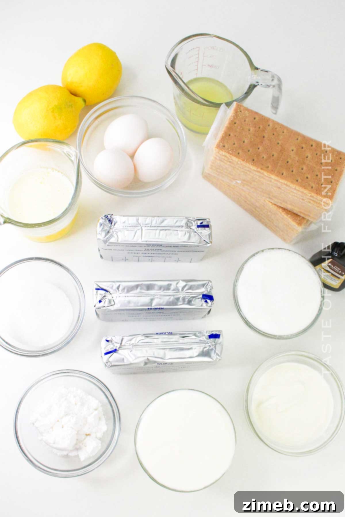 Ingredients for Homemade Lemon Cheesecake, highlighting fresh lemons.