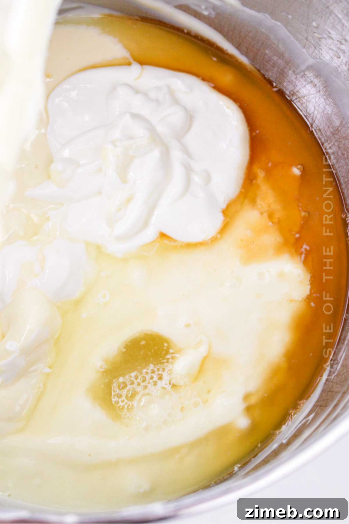 How to make Lemon Cheesecake - showing the filling being poured.