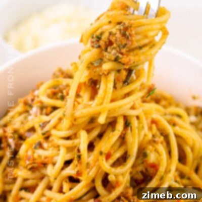 Sicily's Sun-Kissed Tomato Pesto 16 Pesto alla Trapanese in a small bowl with ingredients around it