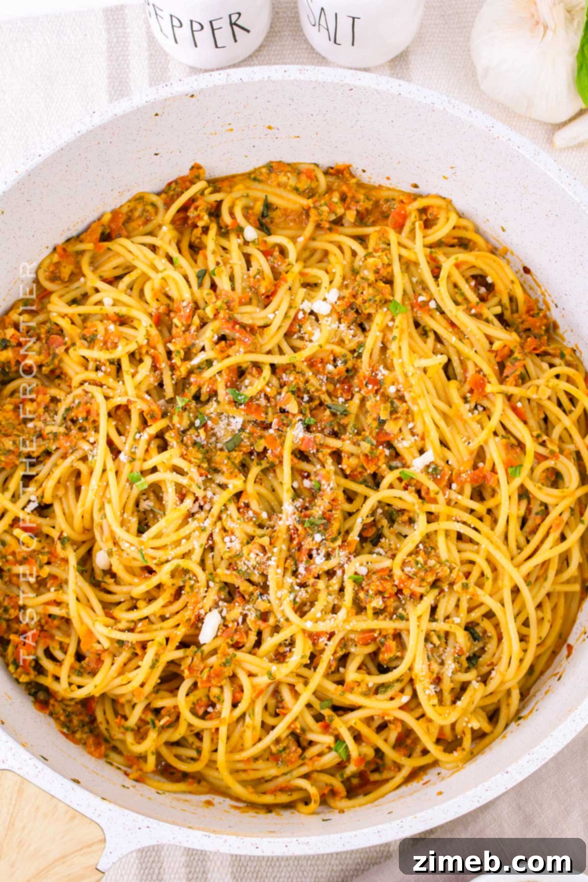 Sicily's Sun-Kissed Tomato Pesto 3 Pesto alla Trapanese served with pasta, garnished with fresh basil leaves