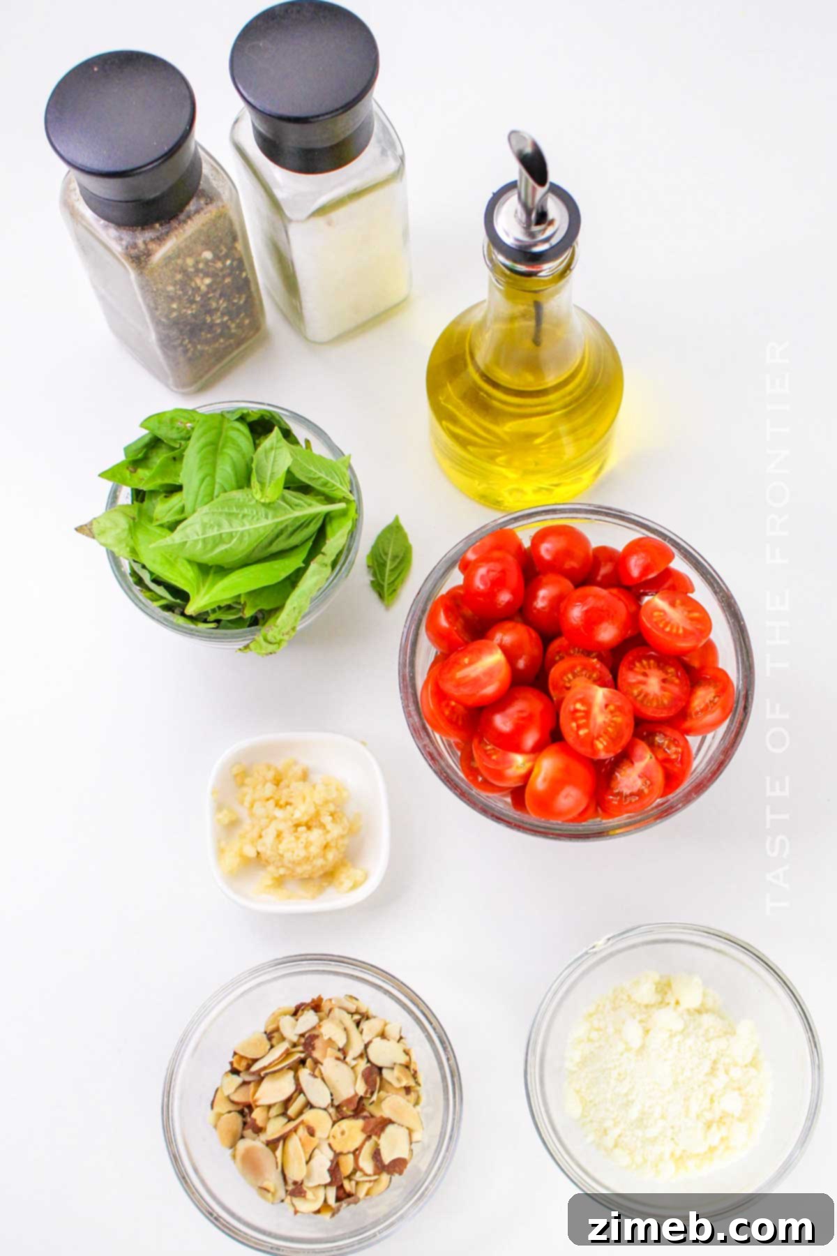 Sicily's Sun-Kissed Tomato Pesto 4 Fresh and vibrant ingredients laid out for making Pesto alla Trapanese