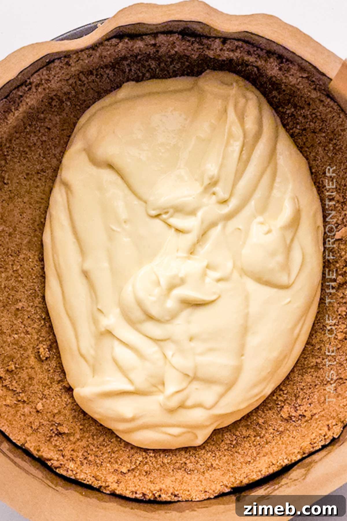 Close-up of creamy cheesecake filling before baking