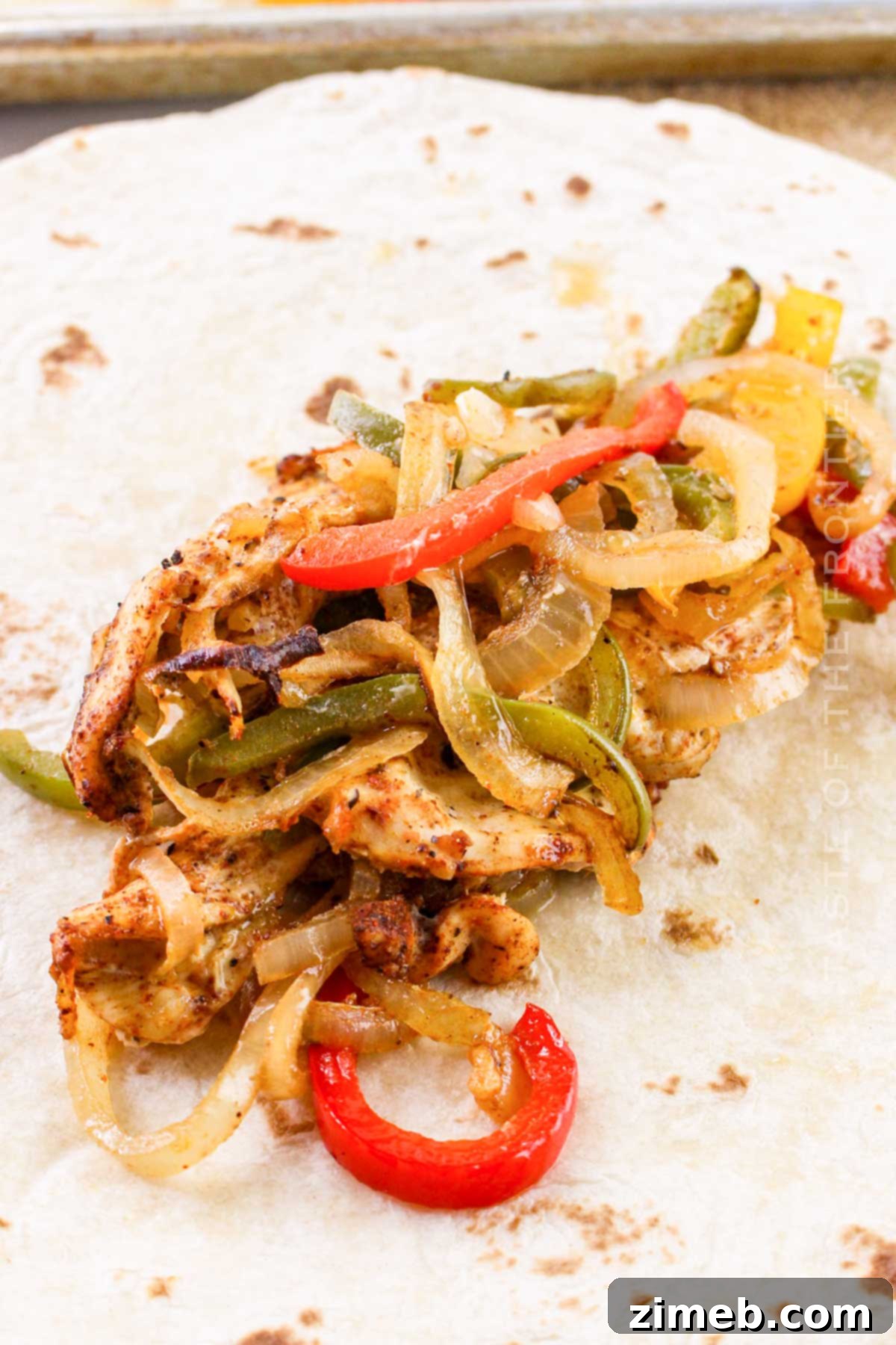 Sizzling Chicken Fajita Wraps 8 Assembling fajitas with various toppings.