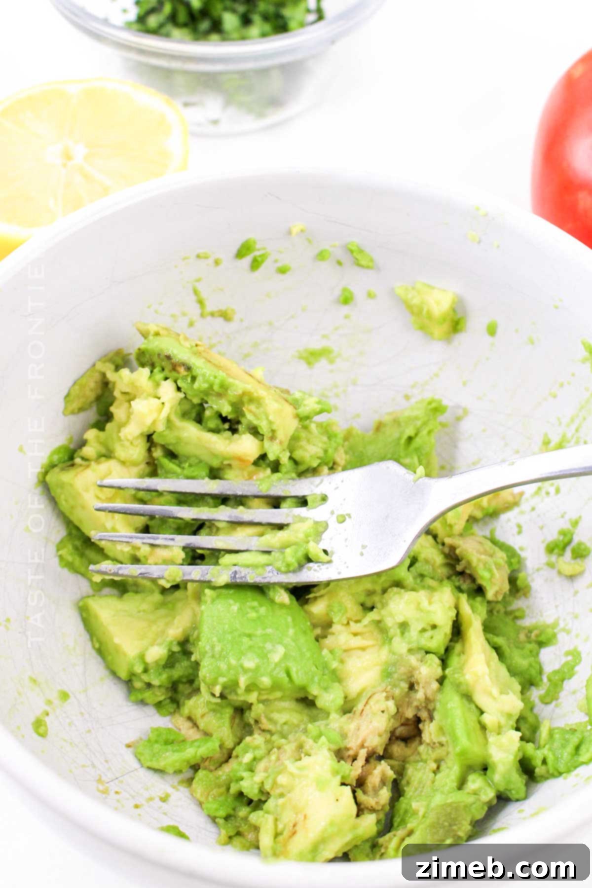 Smashed Avocado Toast with Fresh Tomato 5 mashing the avocado