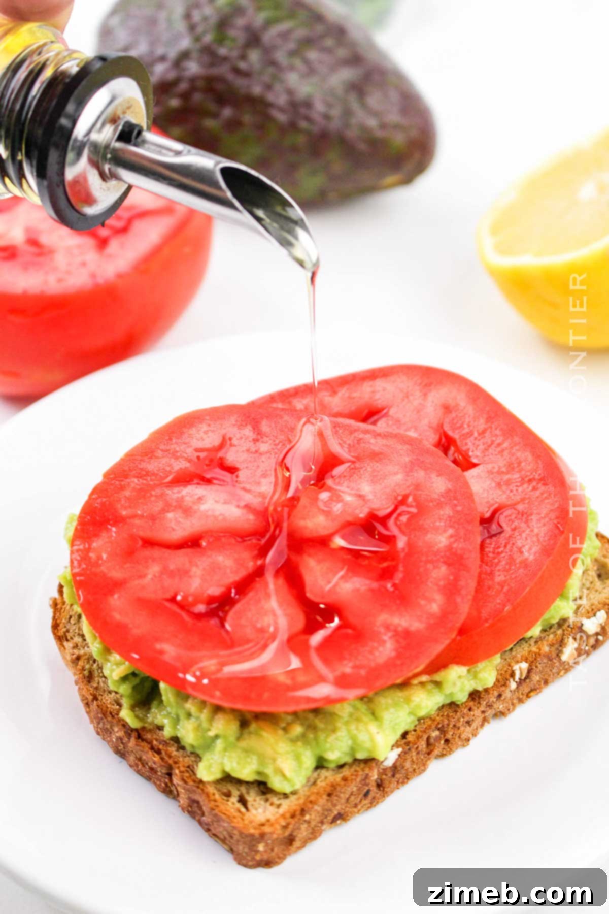 Smashed Avocado Toast with Fresh Tomato 8 drizzle with olive oil