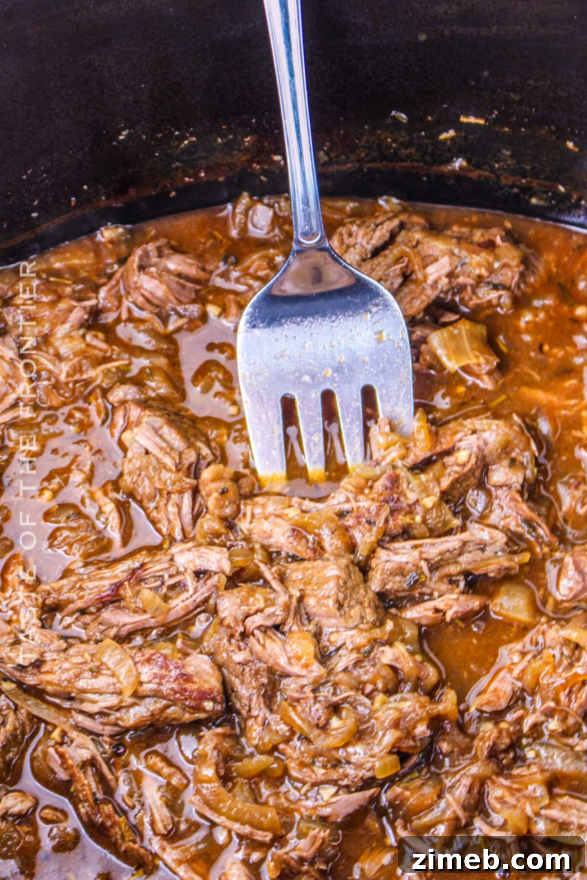 Tender Braised Steak with Caramelized Onions 14 Crock pot steak and onions, showing the finished dish ready to be served.