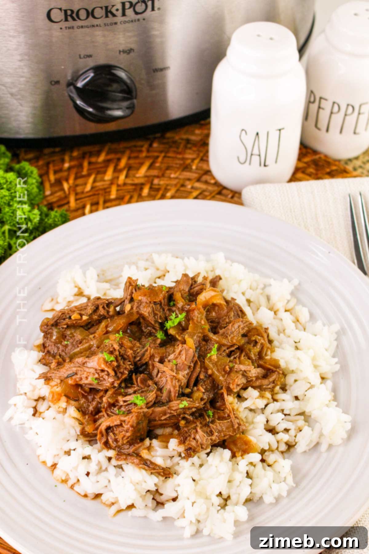 Tender Braised Steak with Caramelized Onions 3 Slow cooker Braised Steak and Onions simmering, showcasing the rich sauce and tender beef.