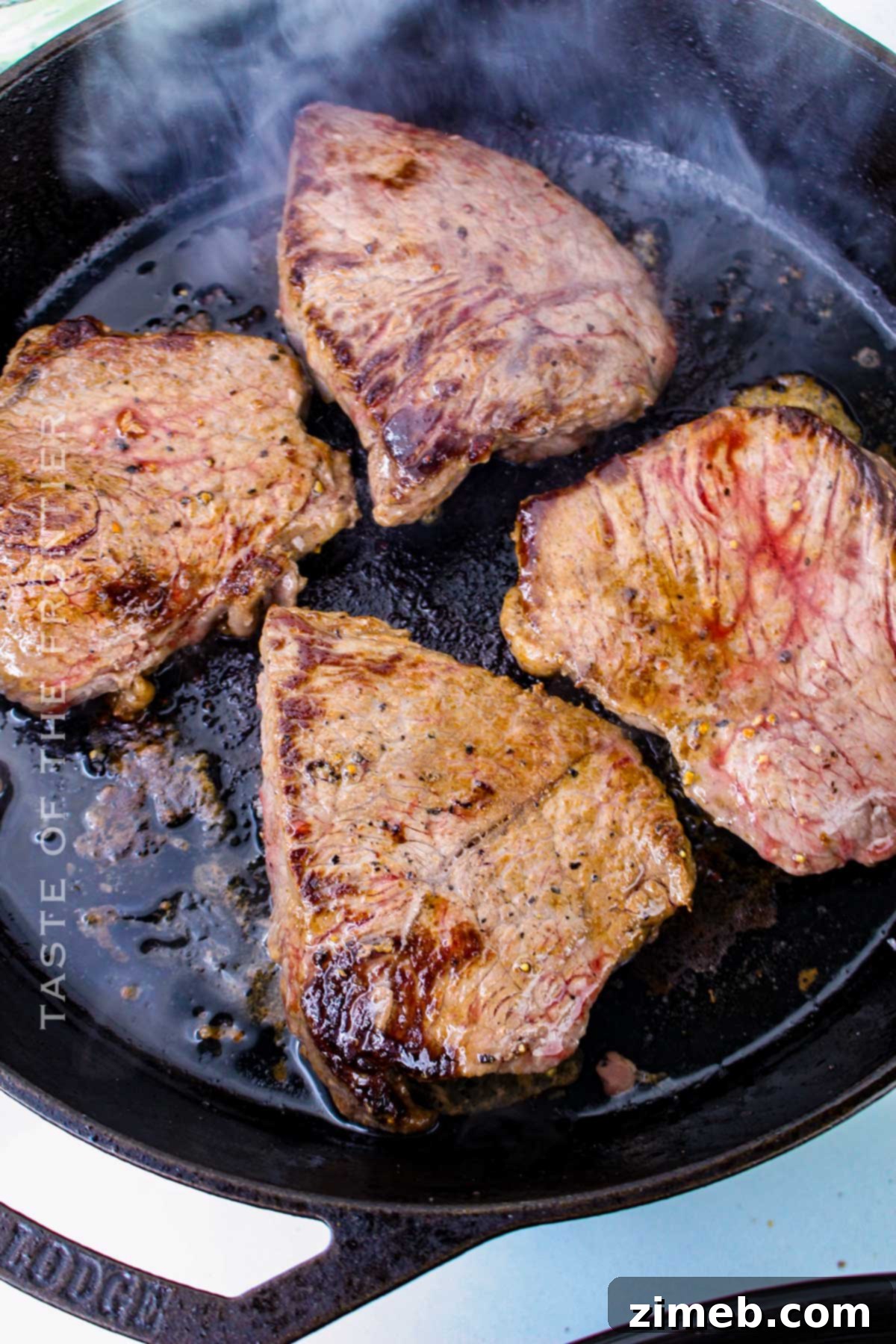 Tender Braised Steak with Caramelized Onions 6 Browning steak on the stovetop in a skillet, an essential step for flavor development.