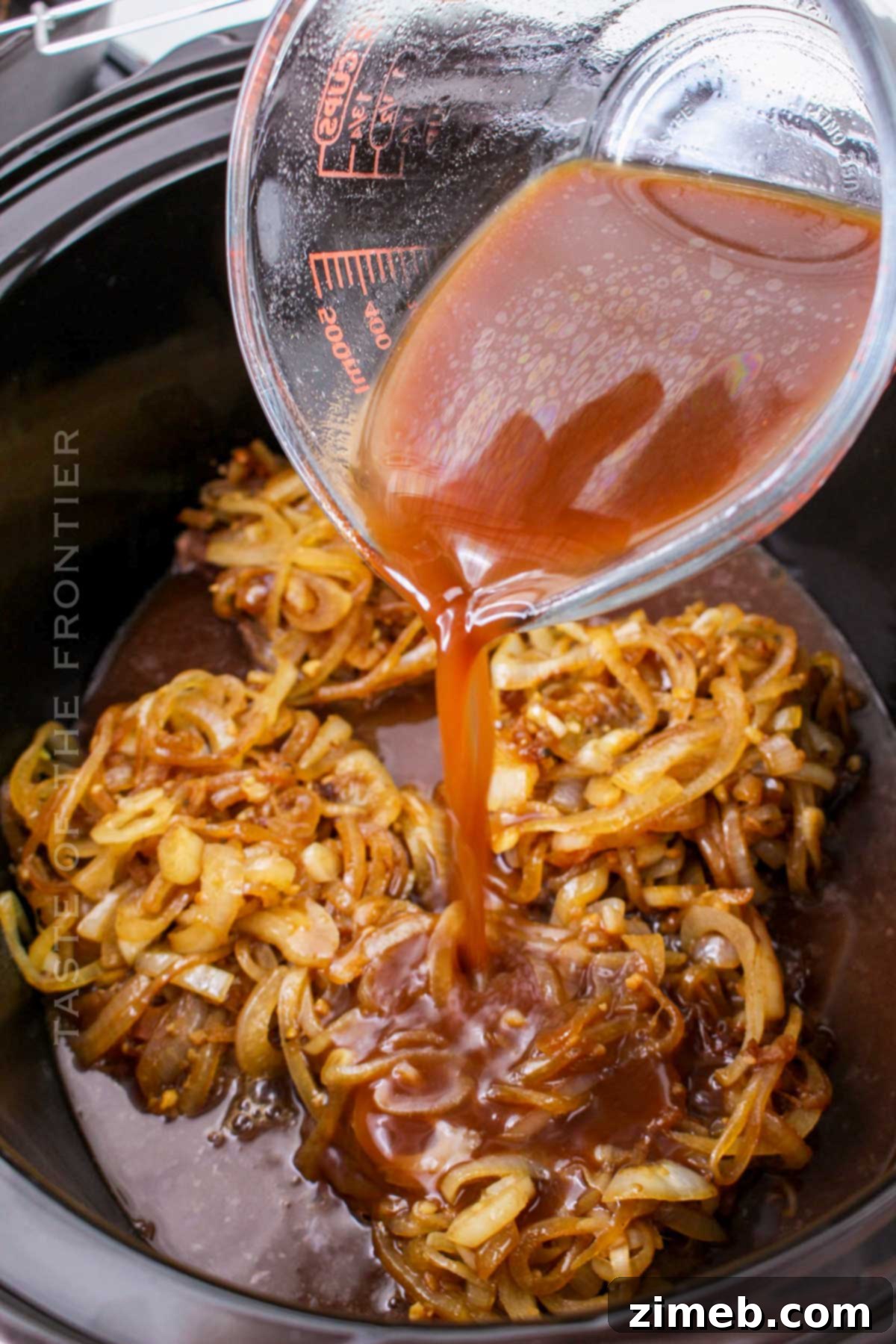 Tender Braised Steak with Caramelized Onions 8 Hearty beef dinner in the slow cooker, ready to be served.
