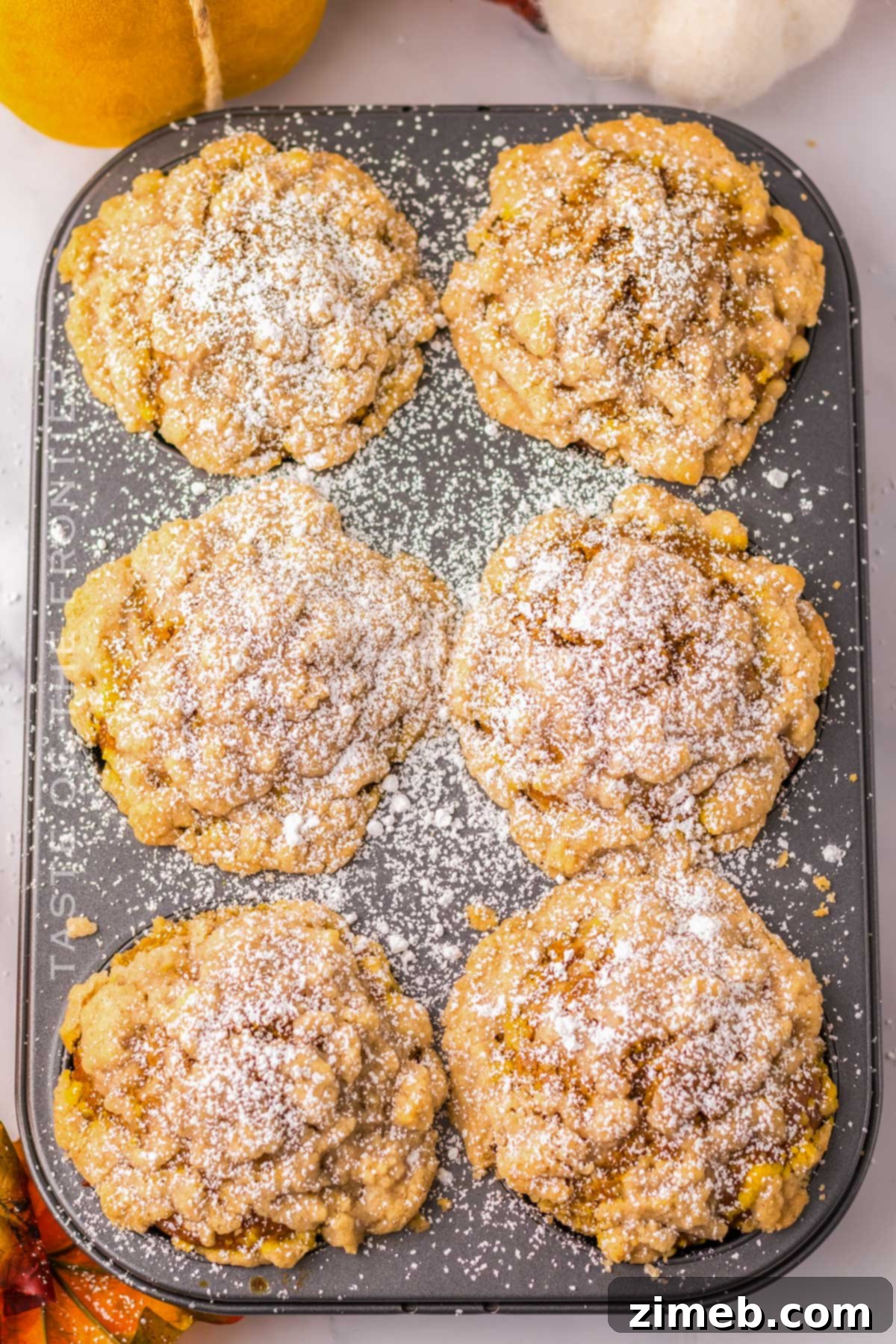 Costco's Irresistible Pumpkin Muffins 3 Freshly baked jumbo pumpkin muffins with streusel topping.