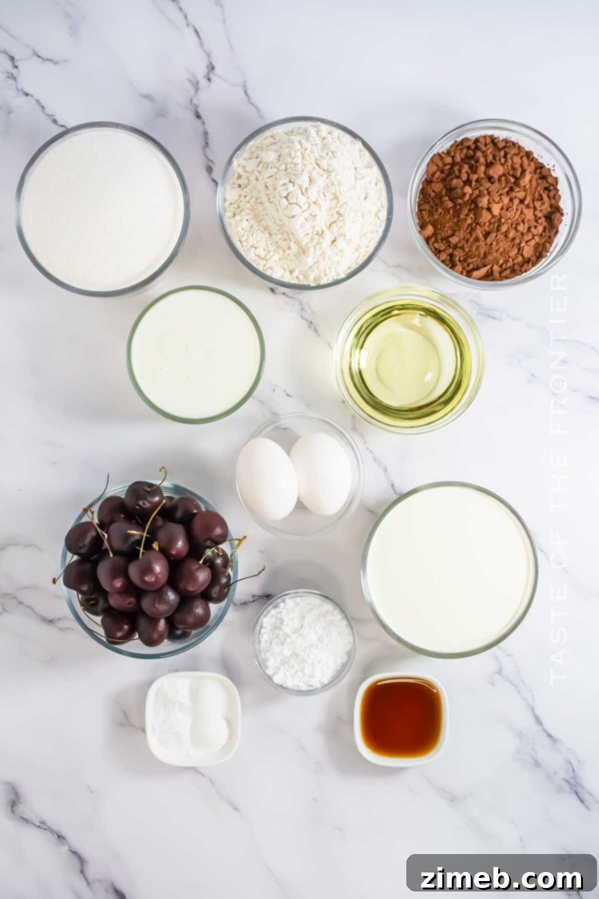 Black Forest Gateau 4 Key ingredients for Black Forest Cake laid out on a table