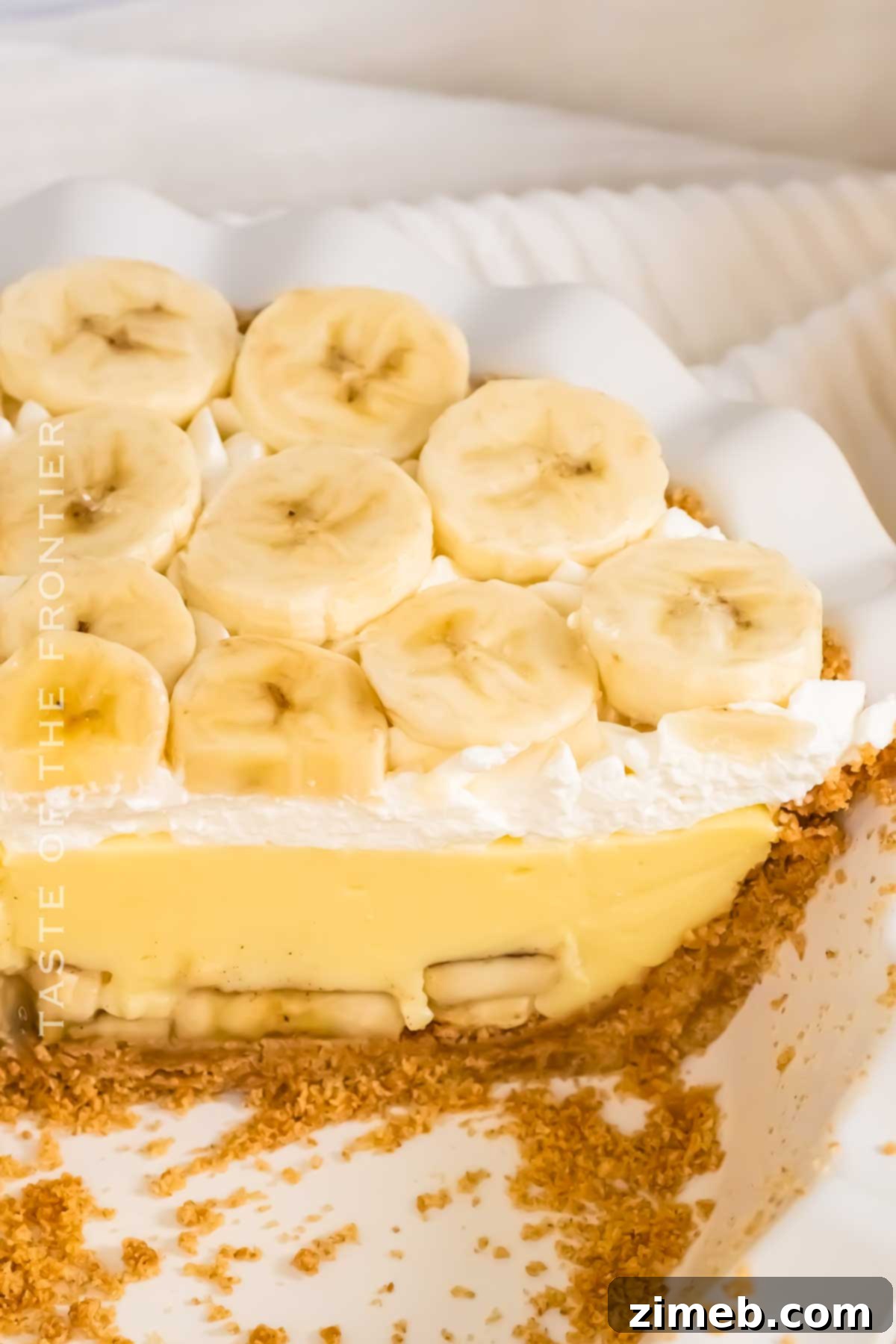 A whole graham cracker crust cream pie