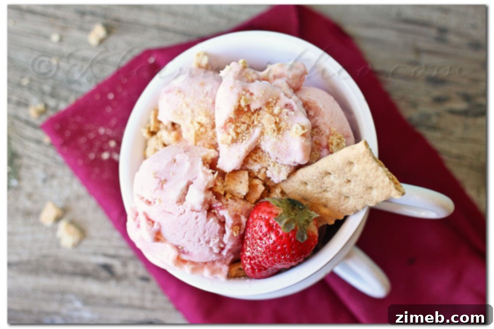 Creamy Strawberry Cheesecake Frozen Yogurt in a serving bowl, showcasing its smooth texture.