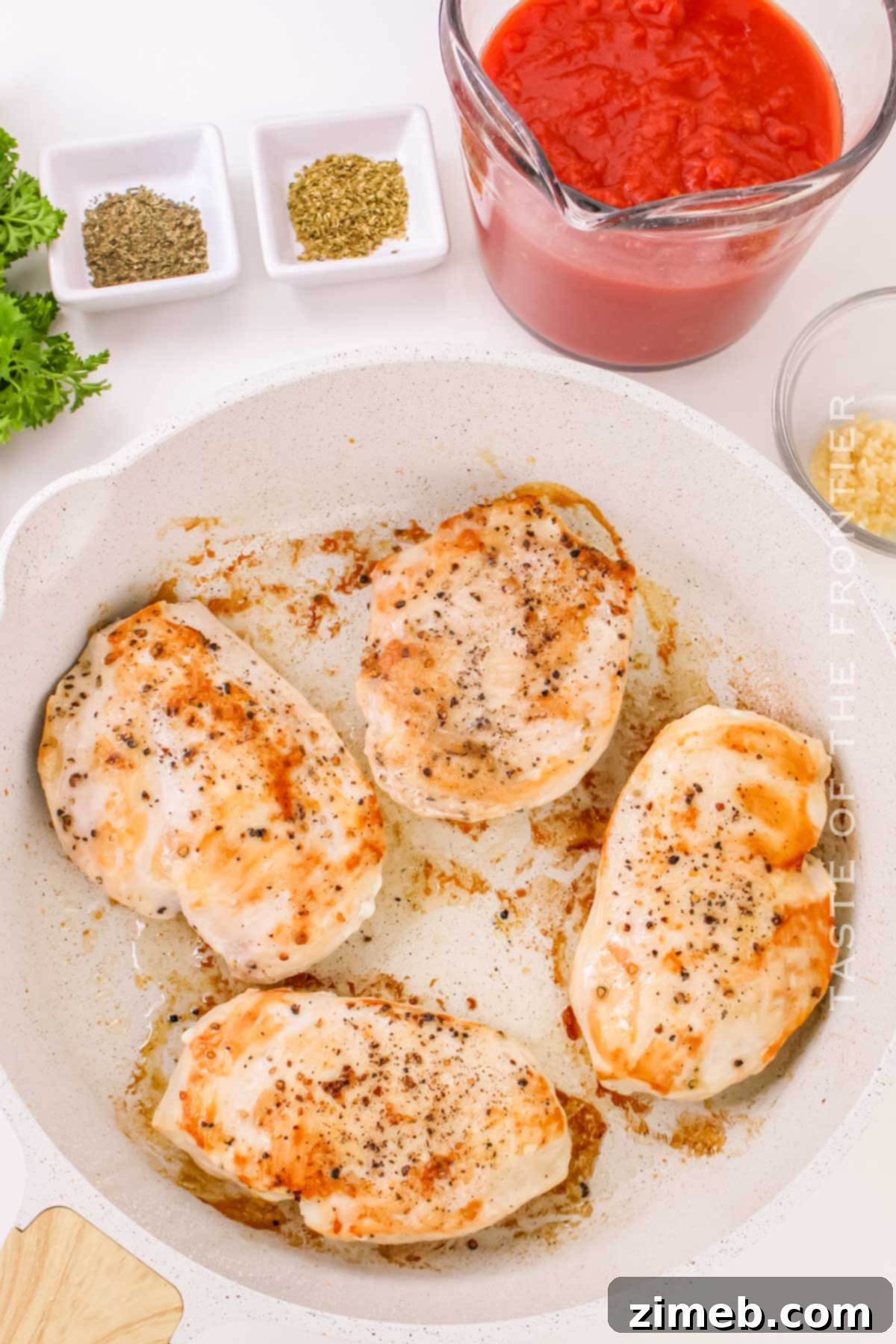 cooking the chicken in the skillet