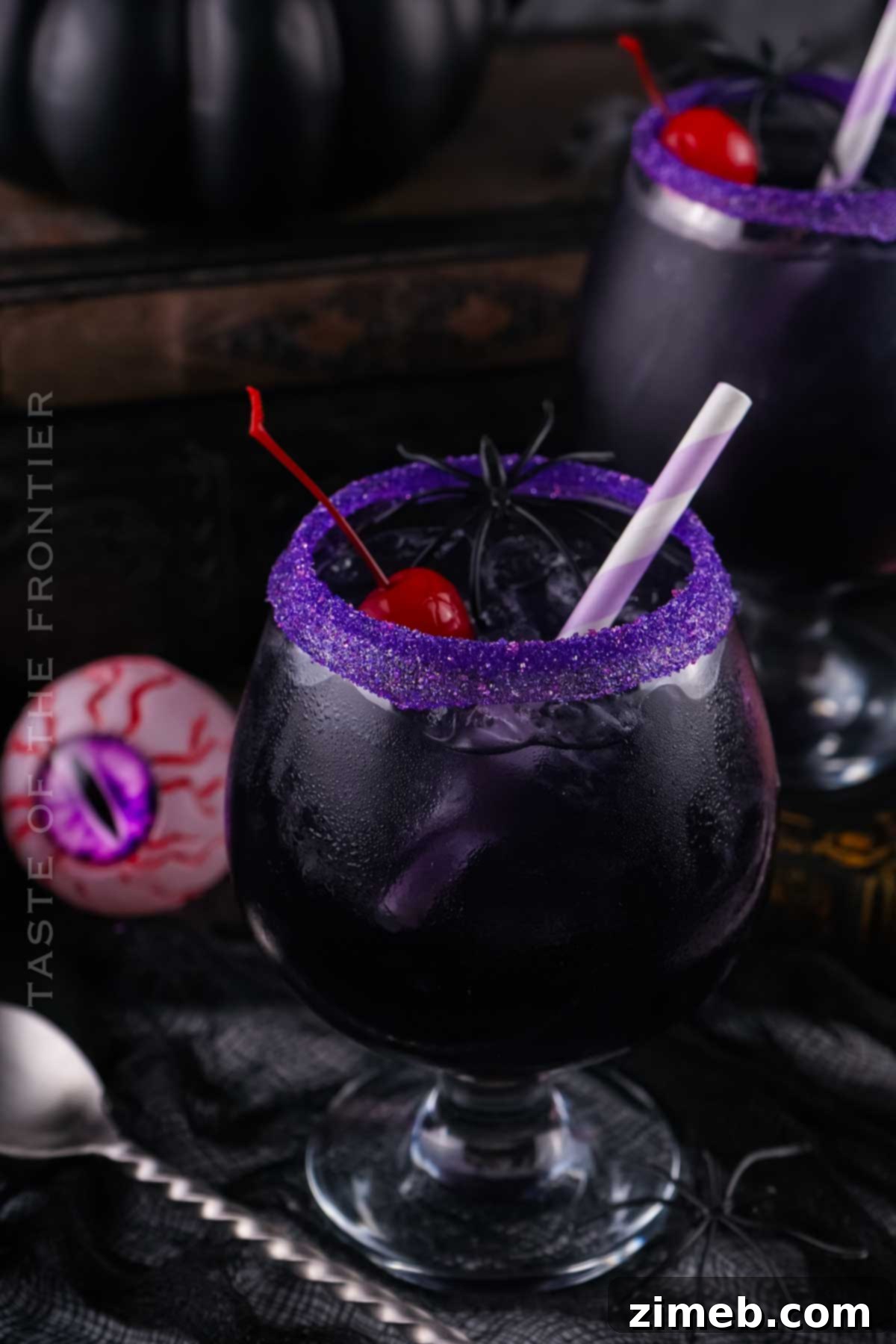 Fun Halloween drink with purple straw and spider