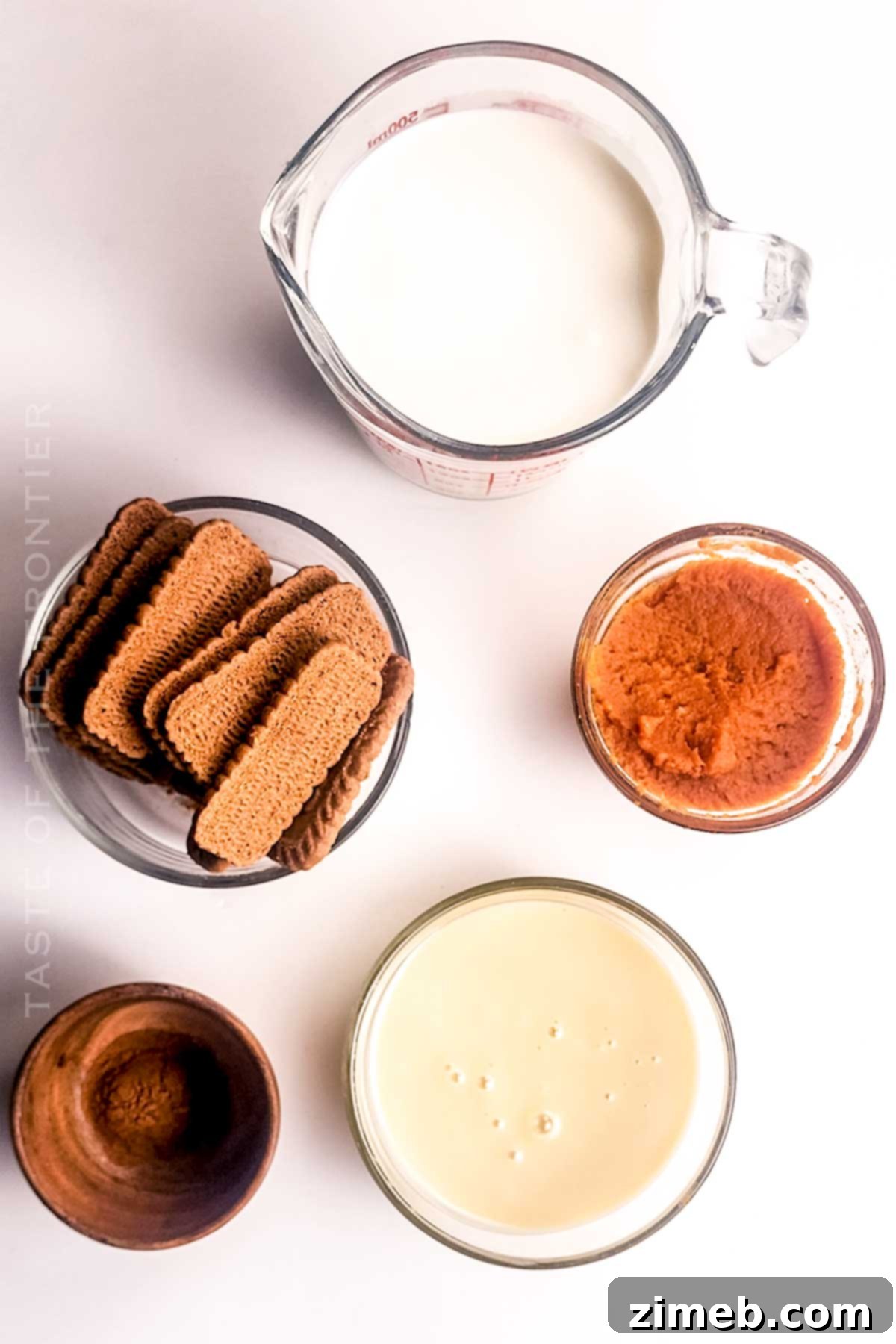 Various ingredients for Pumpkin Pie Ice Cream laid out on a table