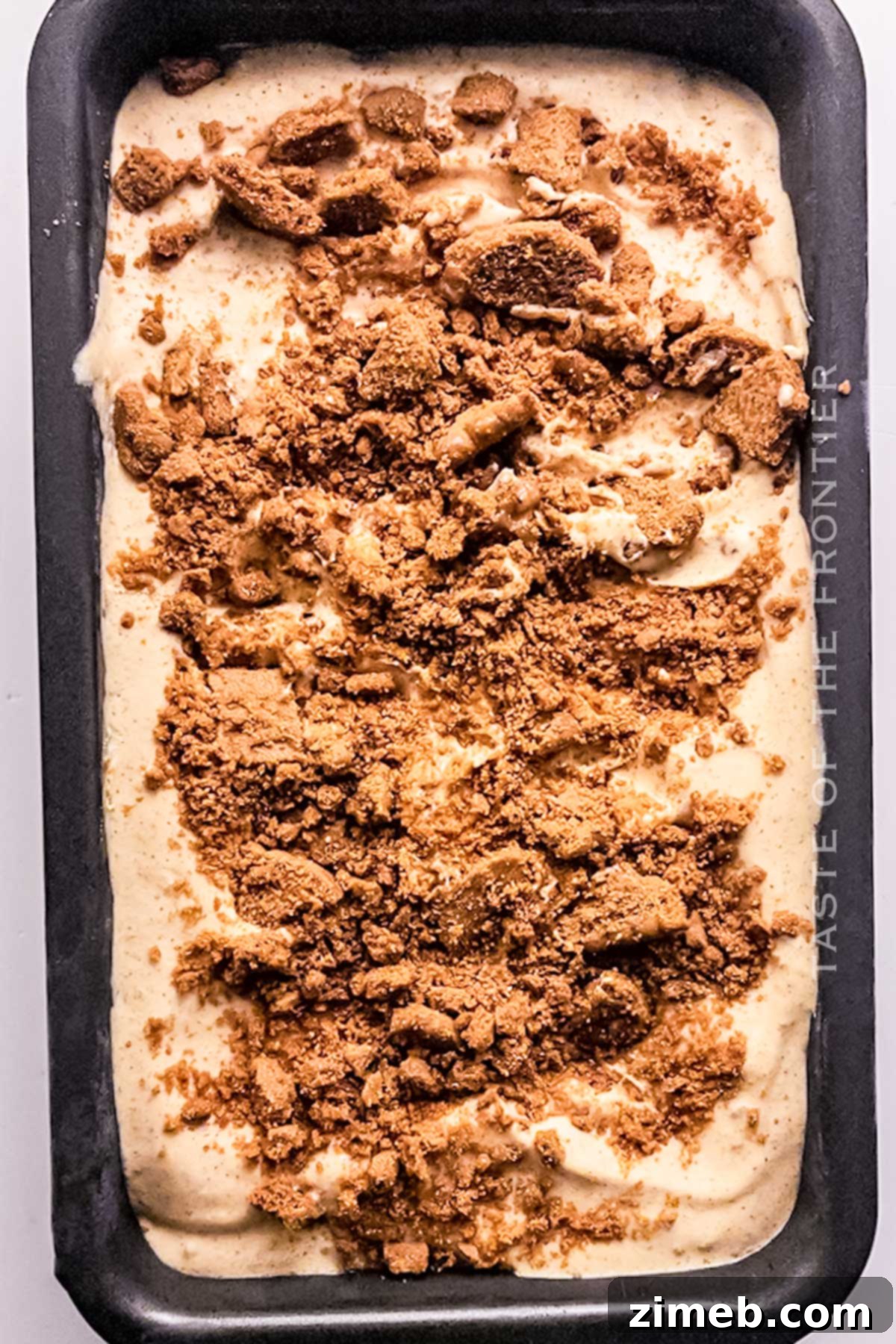 Serving homemade pumpkin ice cream with Biscoff on top