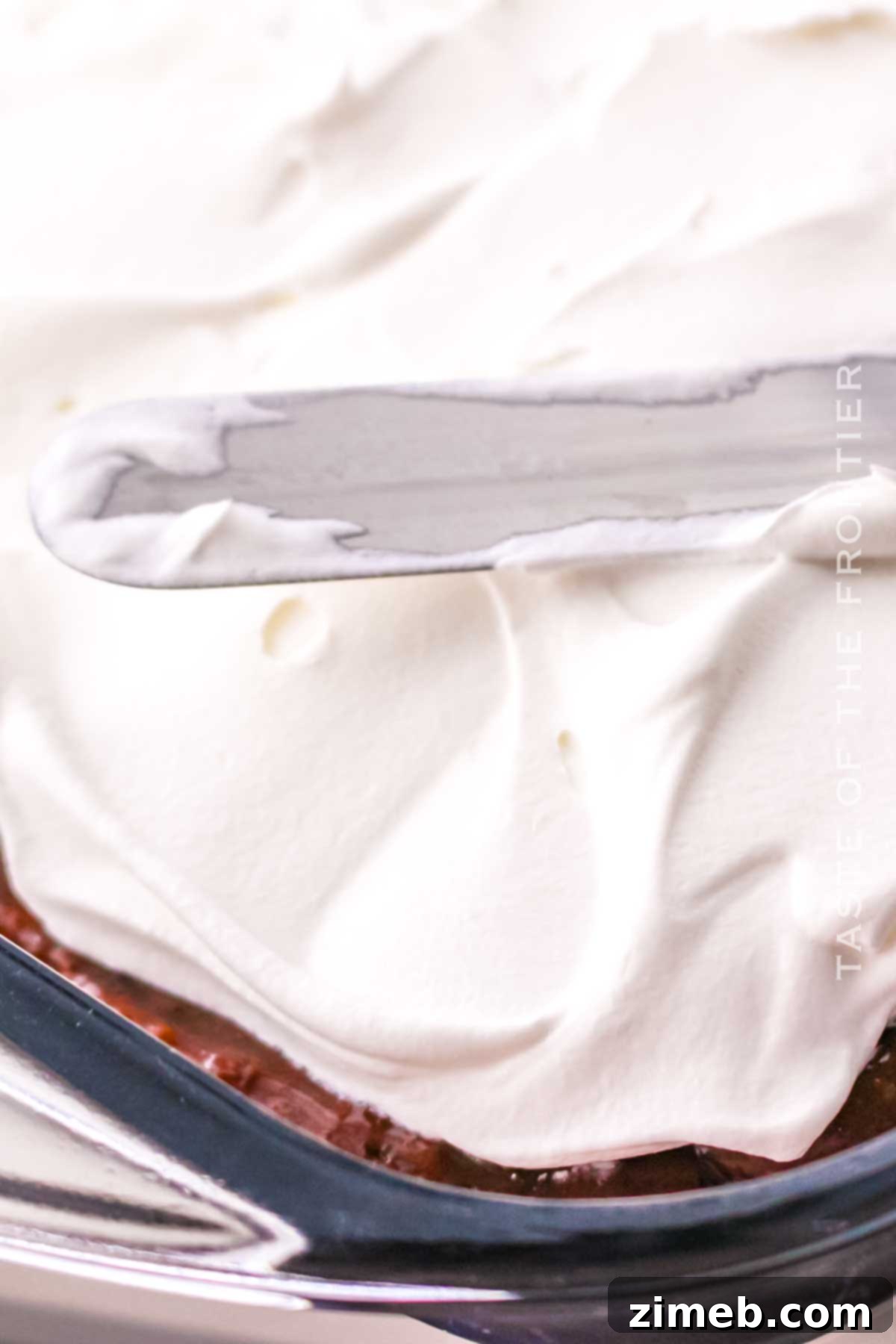 adding the whipped topping layer