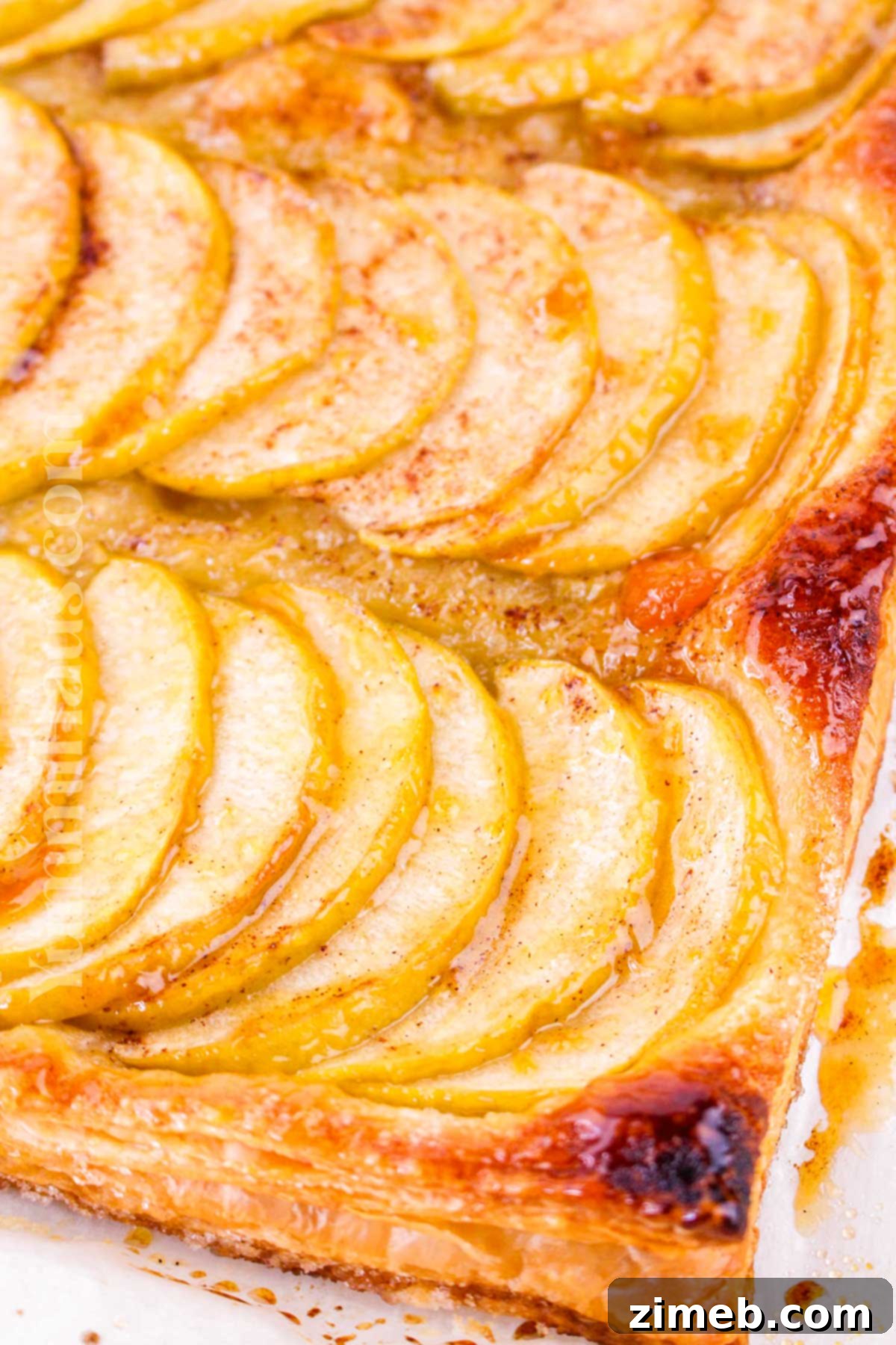 Golden brown puff pastry with perfectly arranged apple slices, a testament to an easy and delicious apple treat.