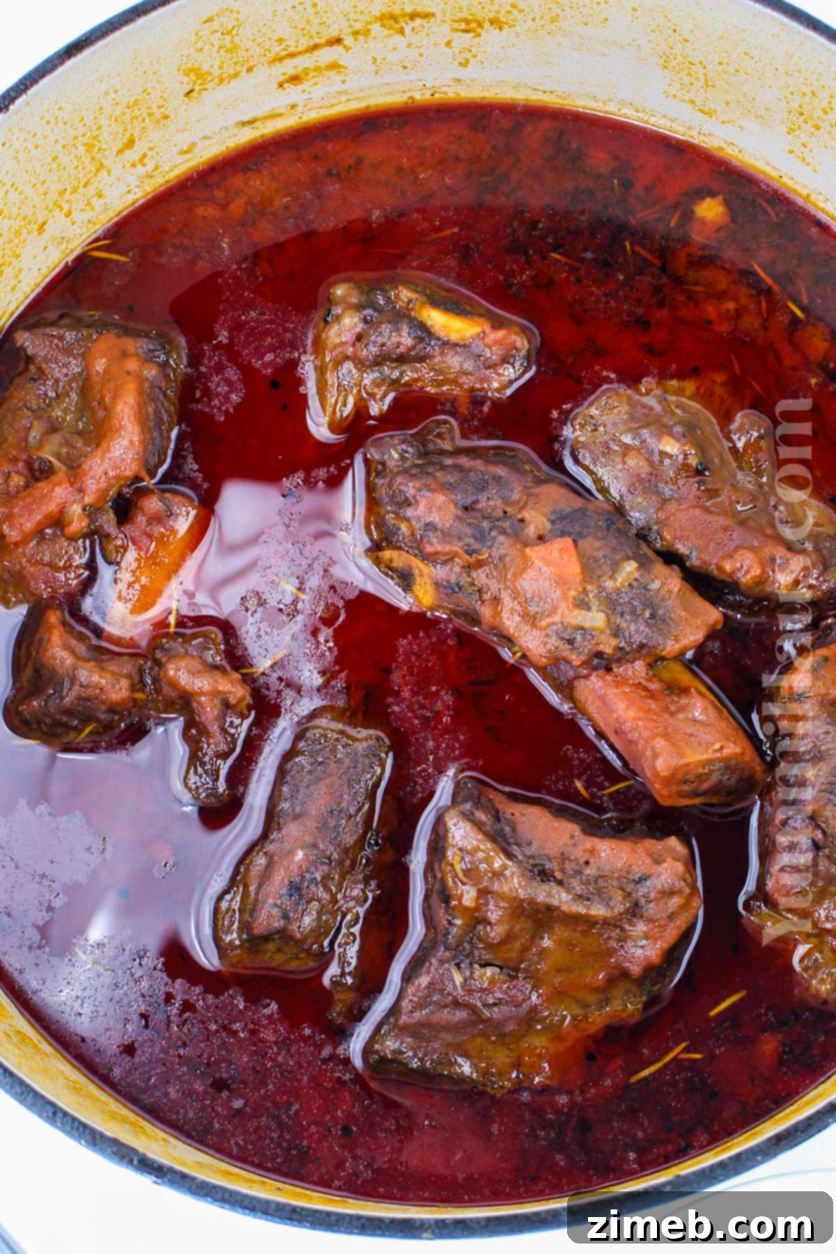 Slow-Braised Beef Short Rib Ragu 6 Beef short ribs browning in a Dutch oven before adding the braising liquid