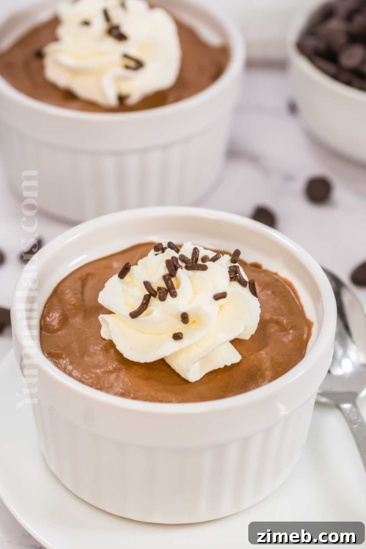 Creamy chocolate no-bake dessert in elegant glasses.