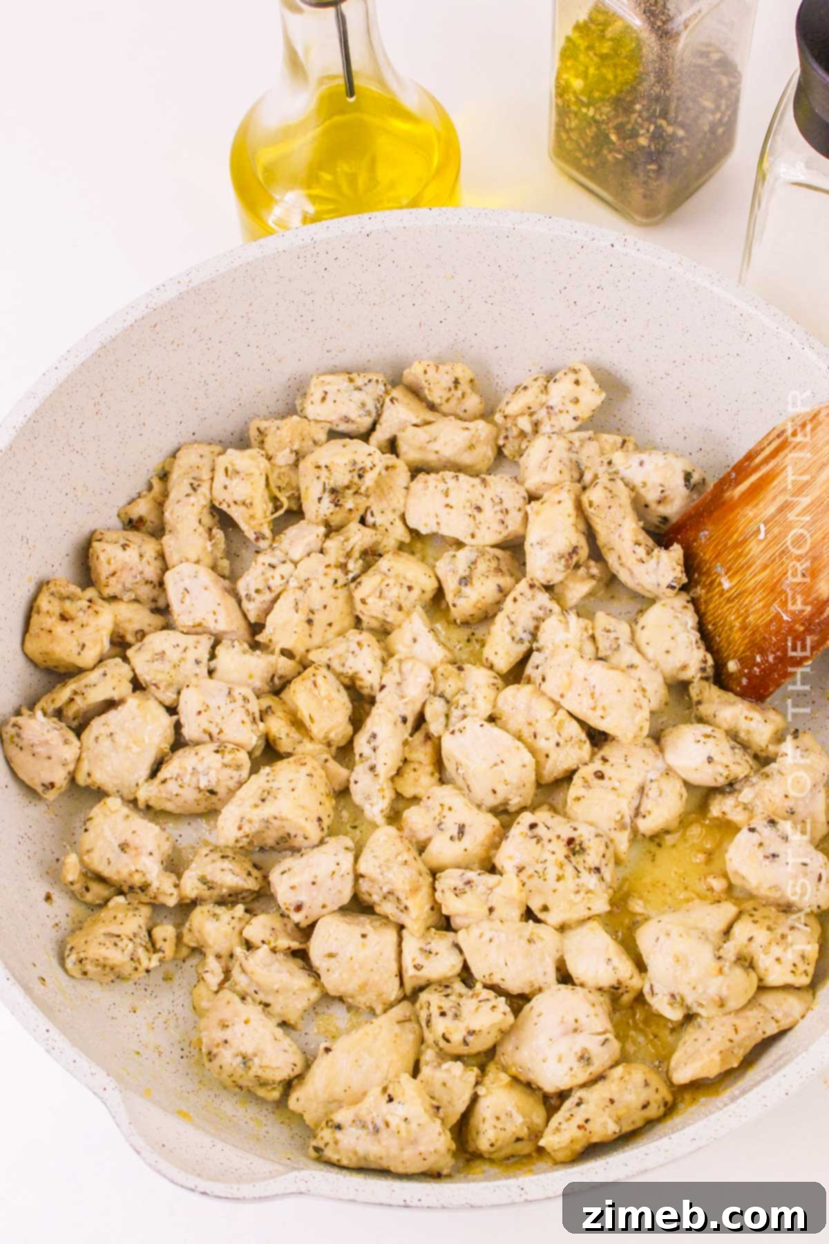 Cooking the chicken to perfection for this Garlic Parmesan Pasta.