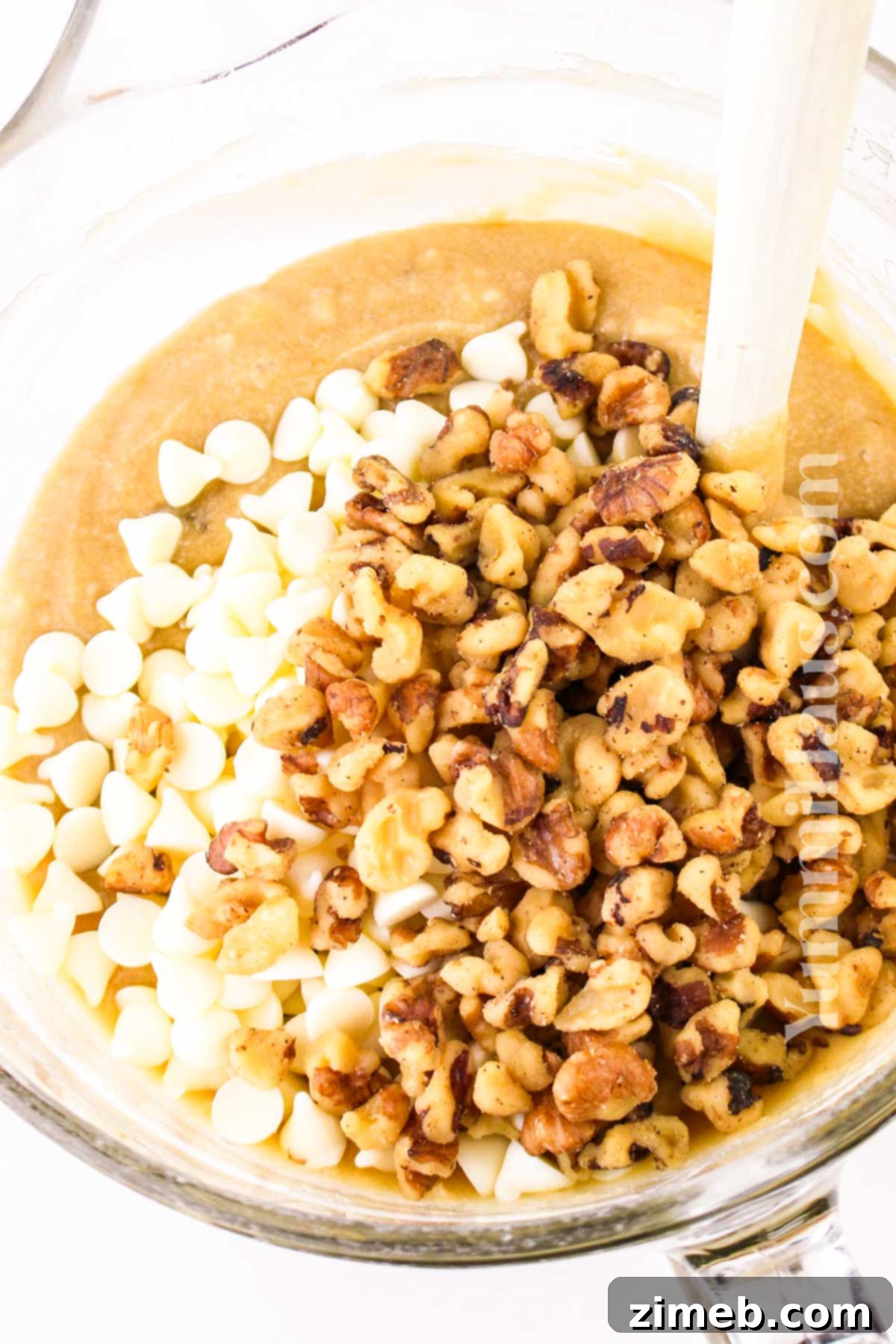 Mixing the banana blondie batter, showing a smooth consistency.