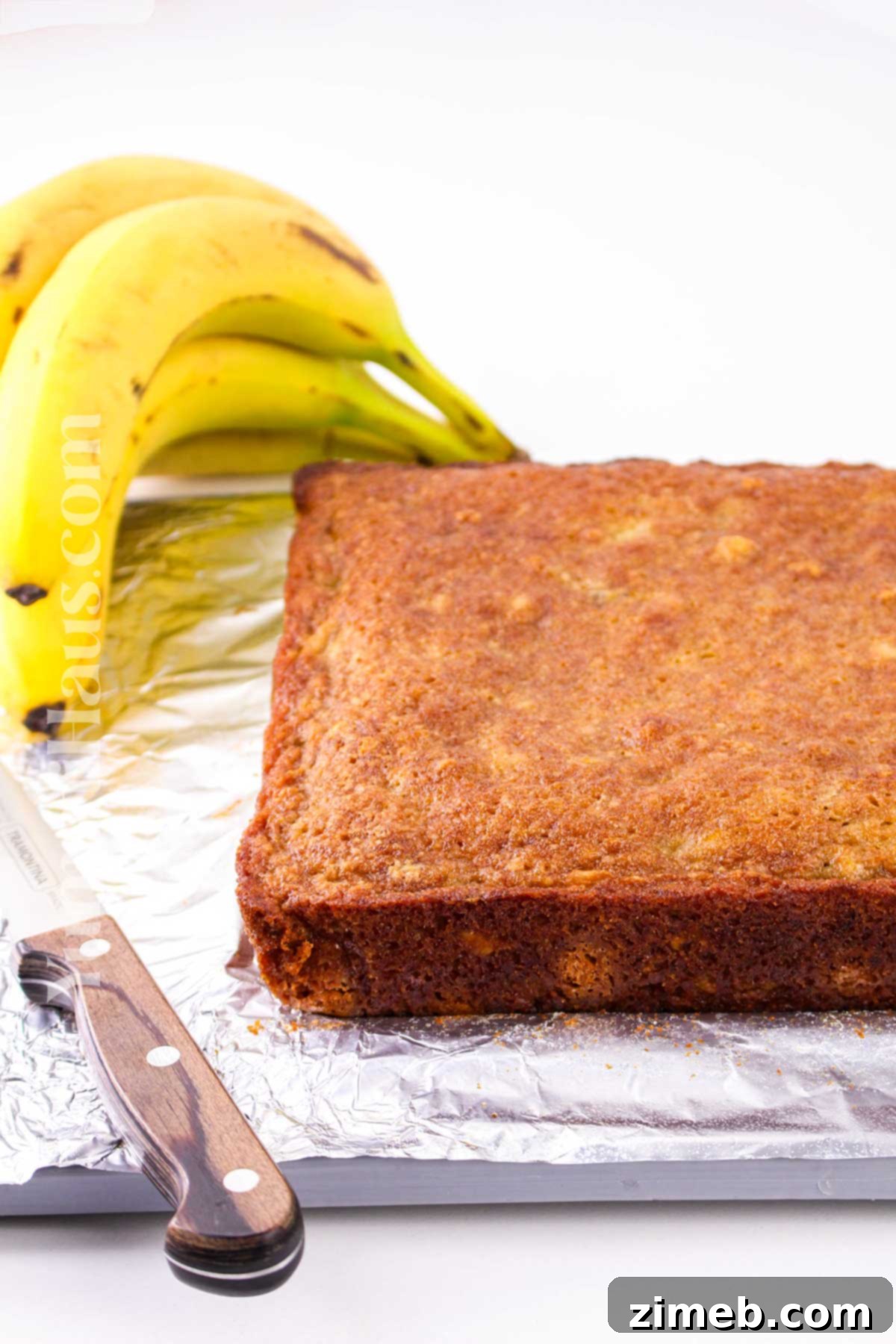 Slicing freshly baked banana blondies into perfect squares.