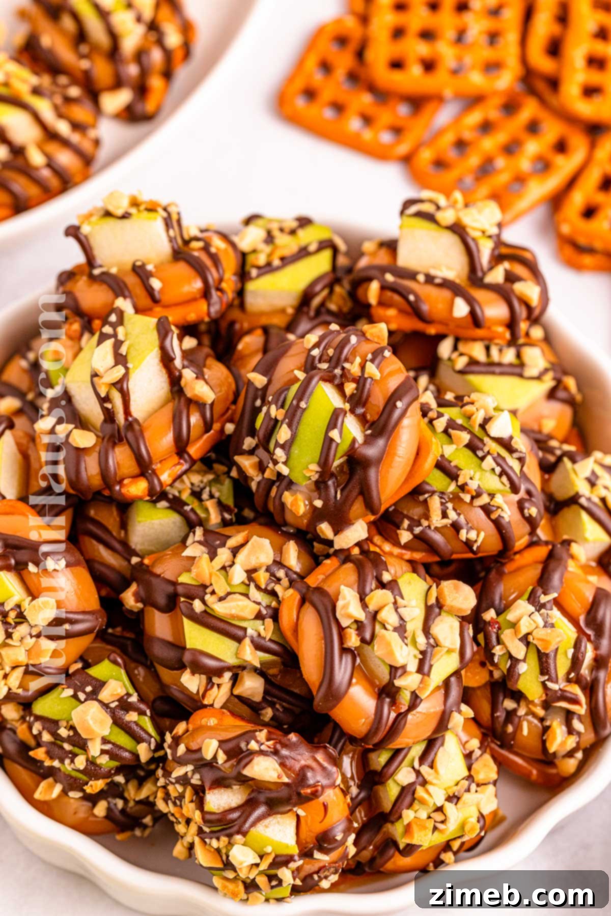 Sweet and Salty Caramel Apple Pretzel Bites 11 A beautifully arranged platter of caramel pretzel dessert bites.