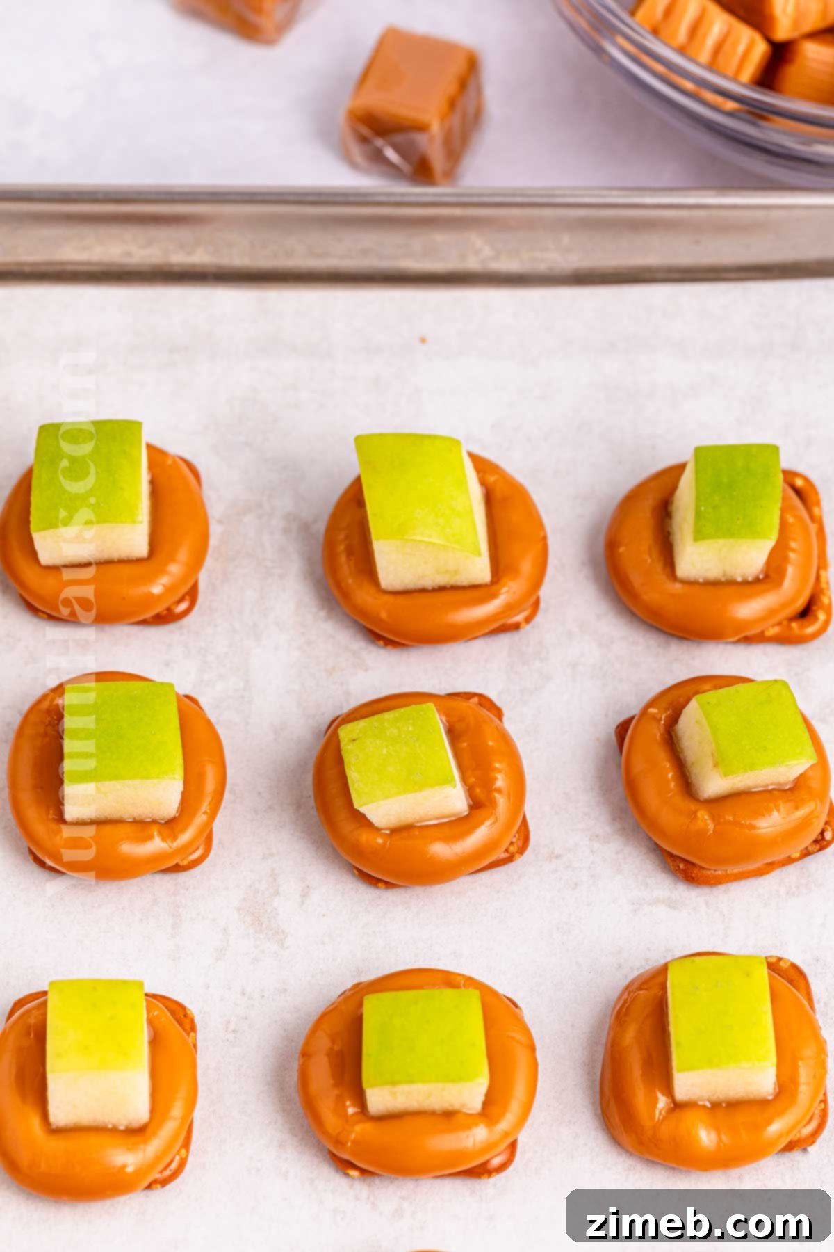 Sweet and Salty Caramel Apple Pretzel Bites 5 Step-by-step image illustrating how to make Caramel Apple Pretzel Bites, showing the caramel and apples.