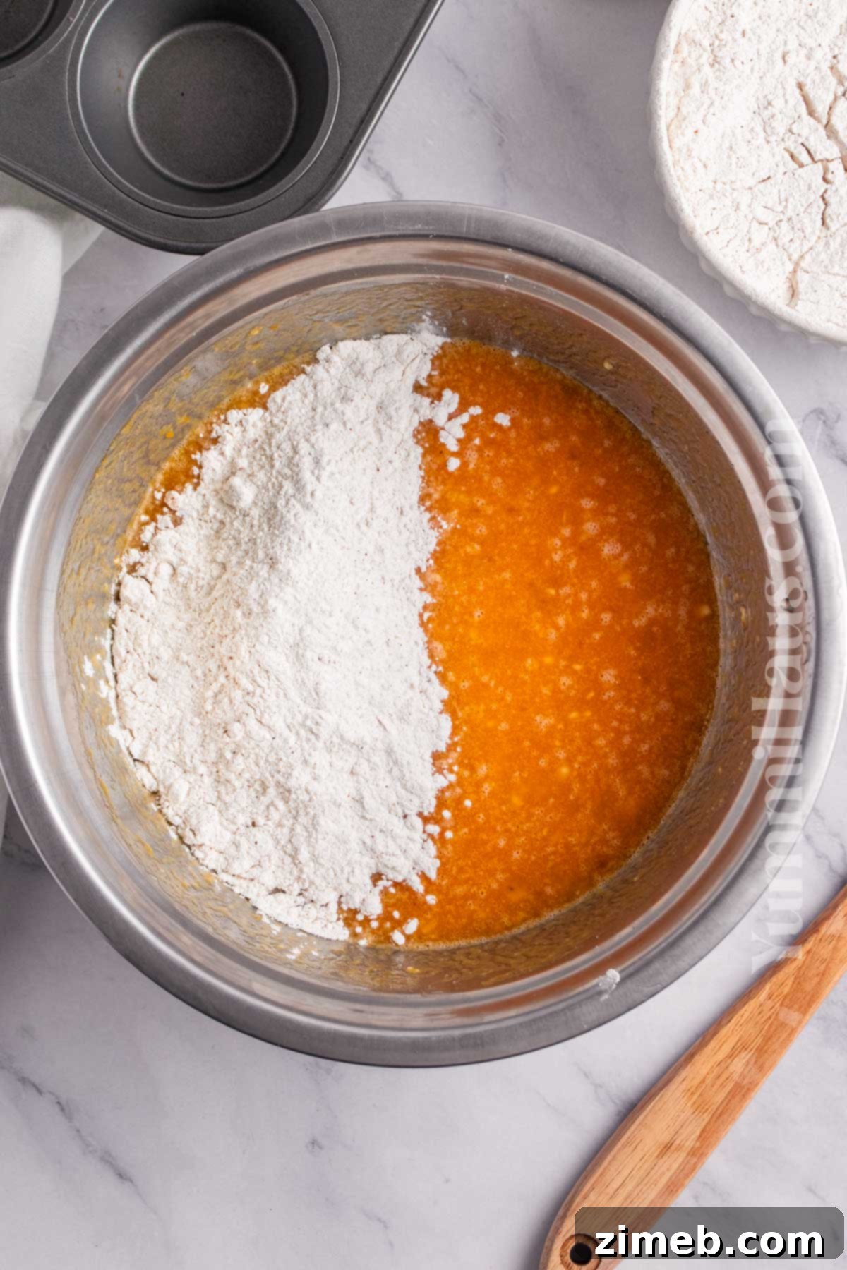 Mixing the banana pumpkin muffin batter