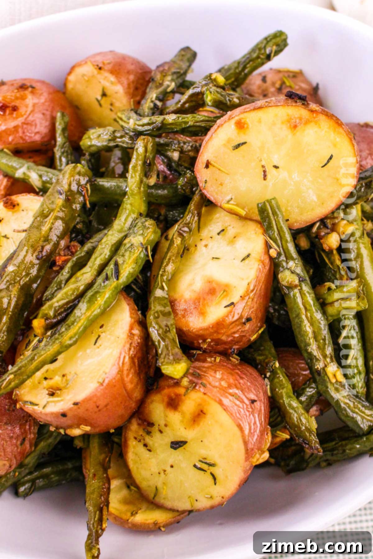 Roasted Green Beans and Potatoes are easy to make and the perfect side dish for family dinners or holiday gatherings.