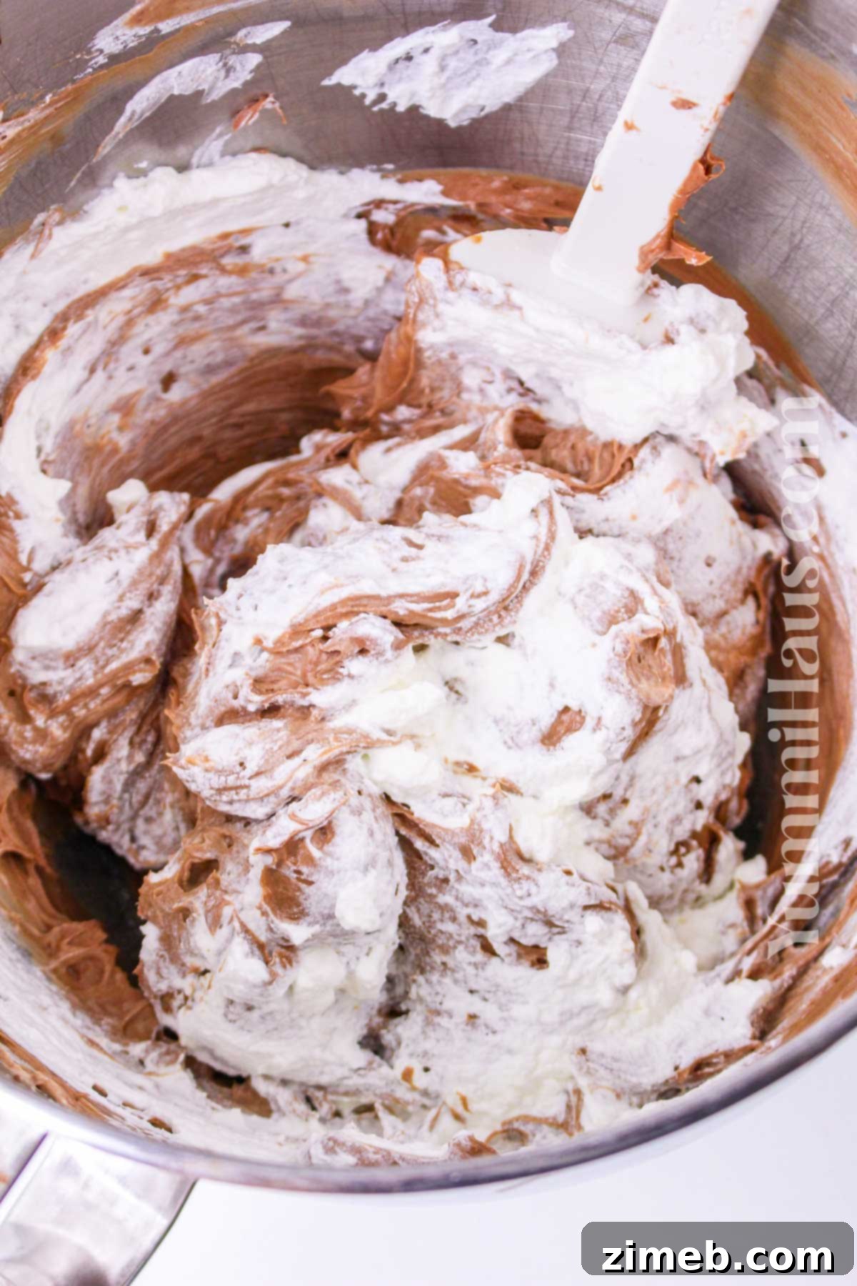 Mixing the chocolate cheesecake filling