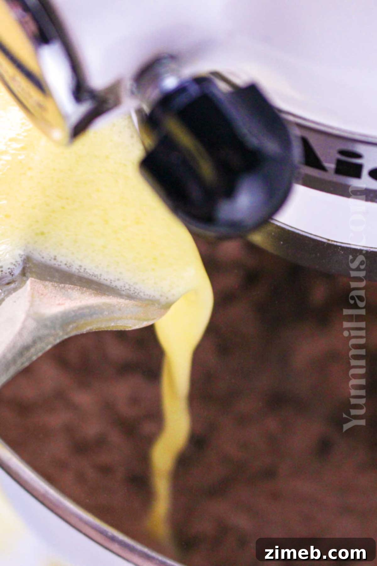 Close-up of freshly mixed chocolate orange cake batter in a bowl.