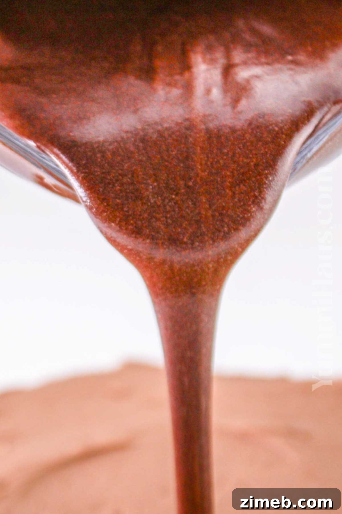 Preparing rich chocolate ganache for the chocolate orange cake.