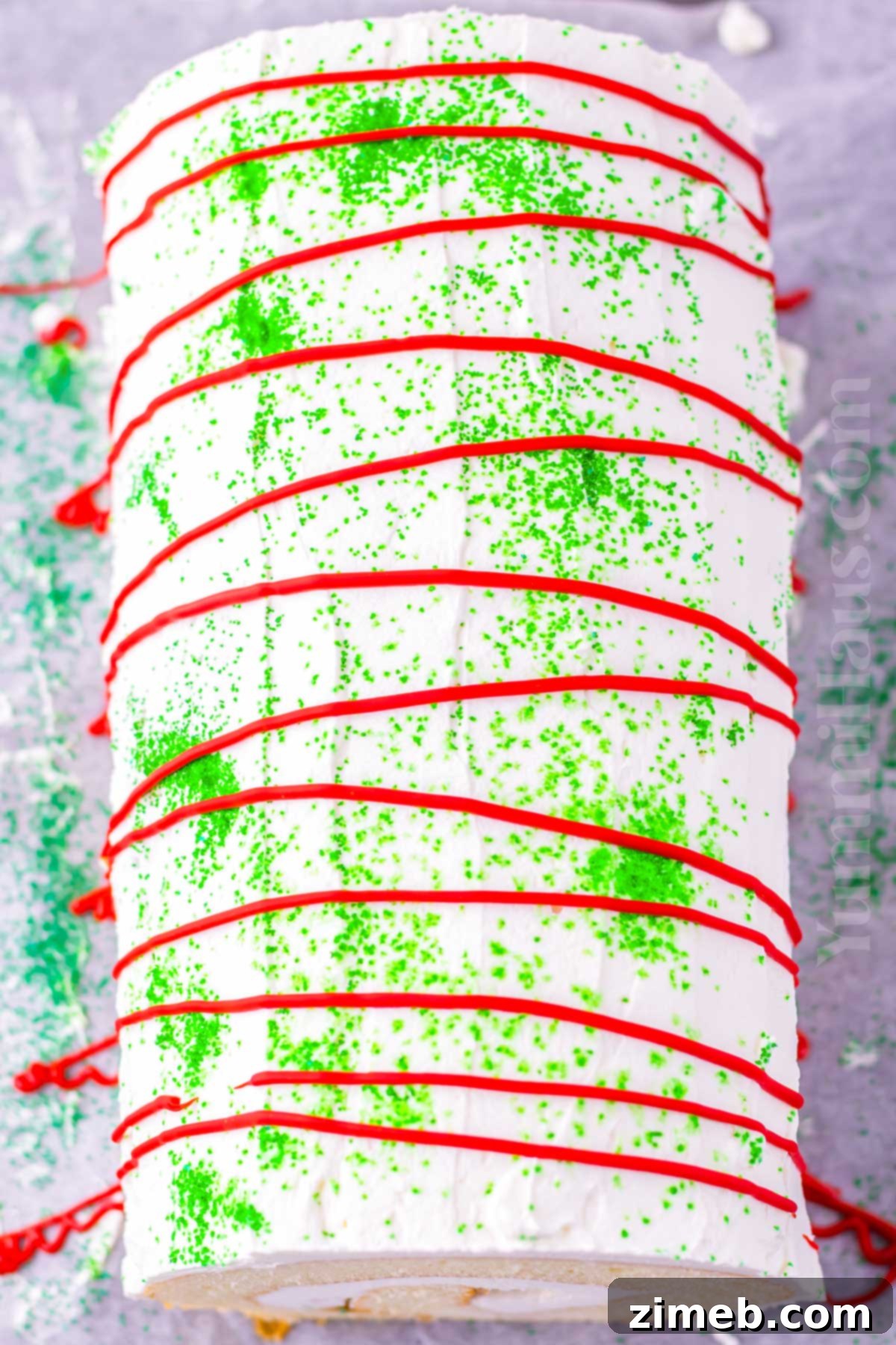 Christmas Yule Log 8 Decorated Christmas Cake Roll with sprinkles and candy drizzle