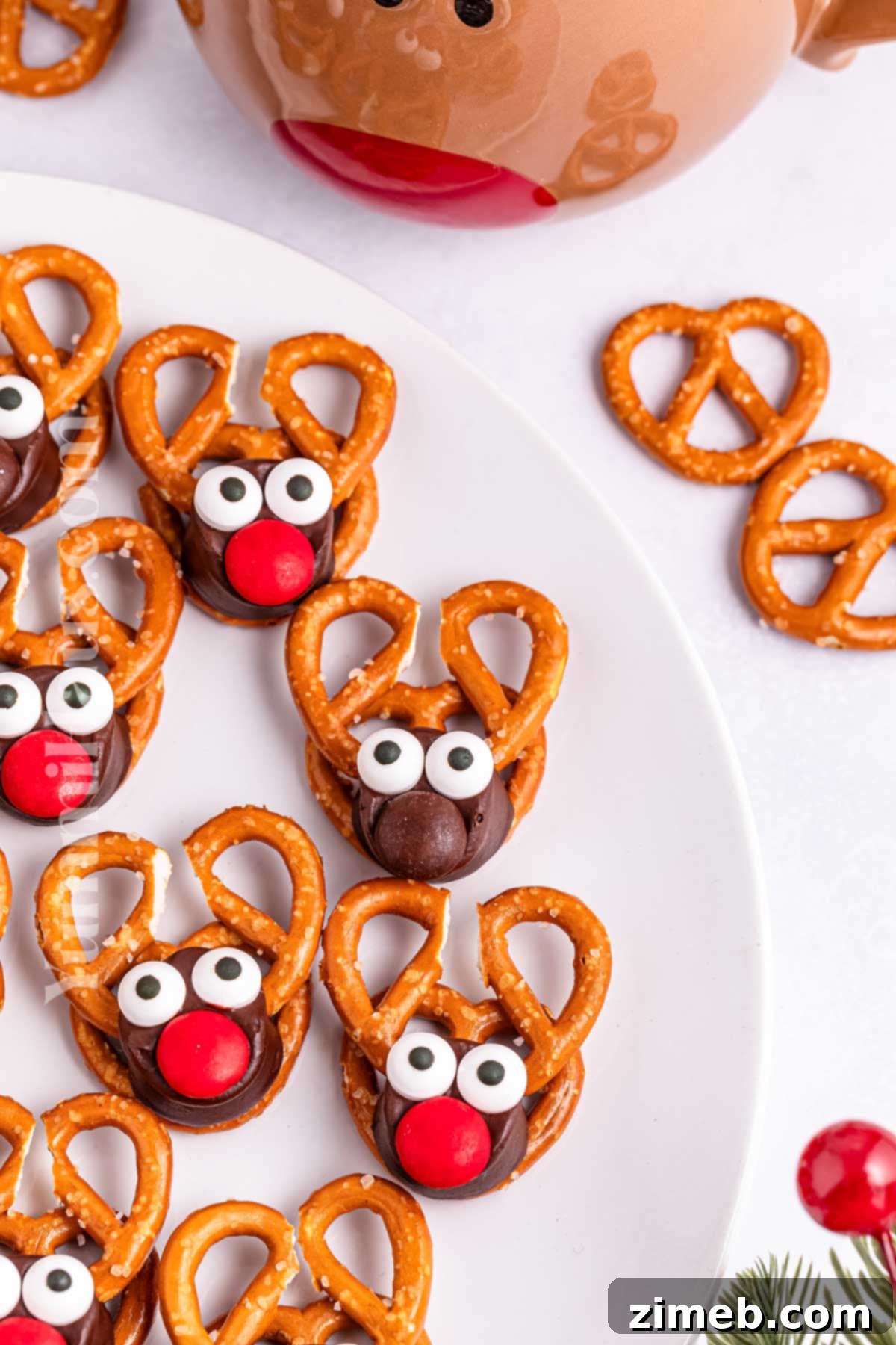 Holiday pretzel treats featuring cute Reindeer Rolo Pretzels on a platter.