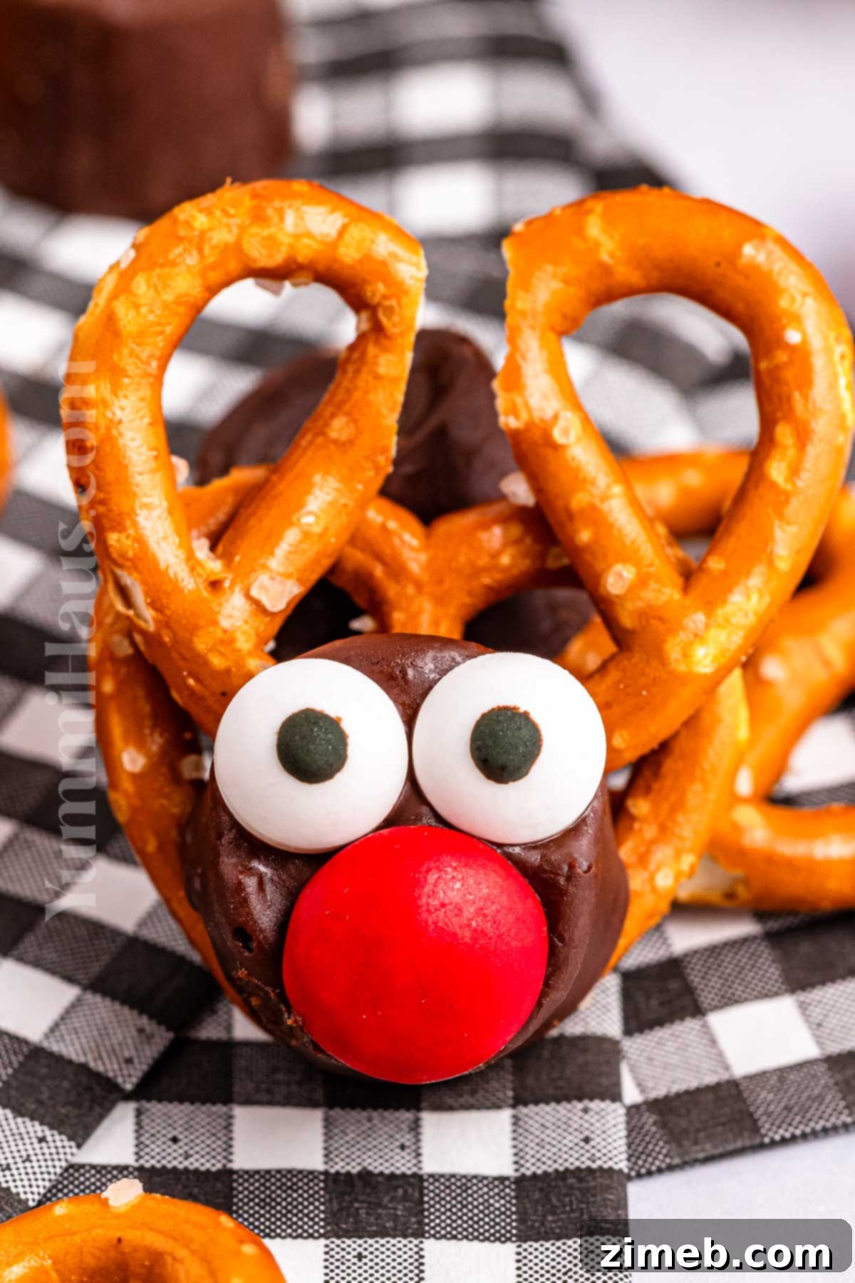 Delicious pretzel treat for the holidays, featuring Rolo candy and festive decorations.