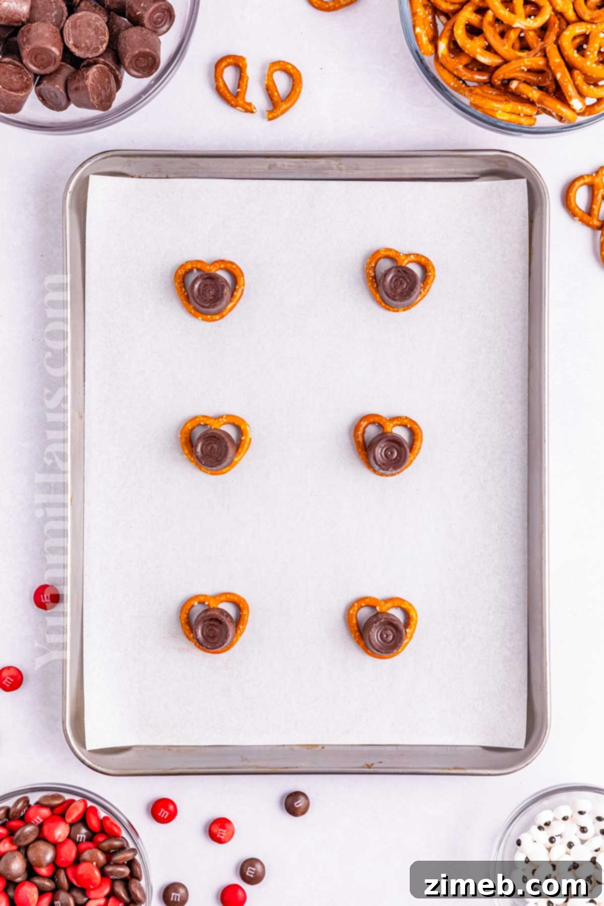 Reindeer Rolo Pretzels baking gently in the oven to soften the candy.