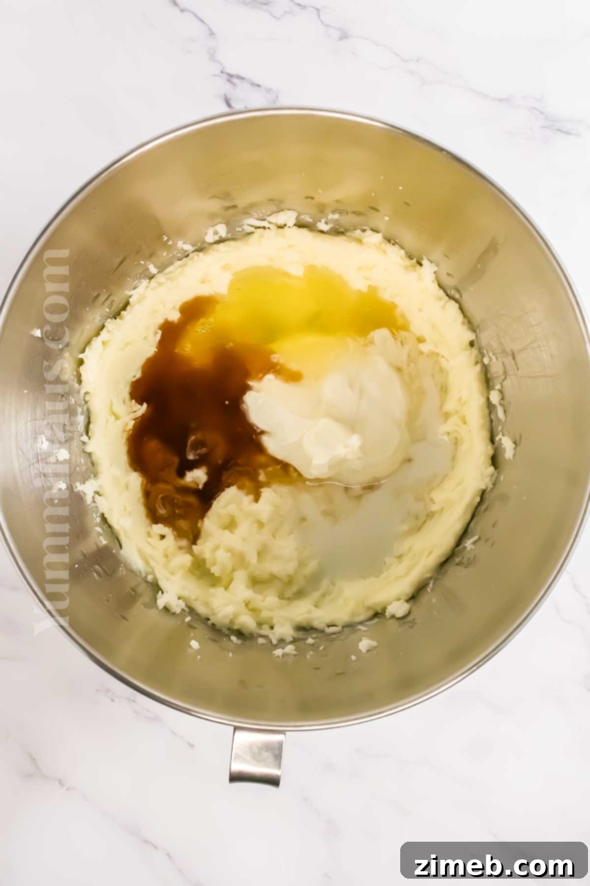 Mixing buttery cake batter in a bowl