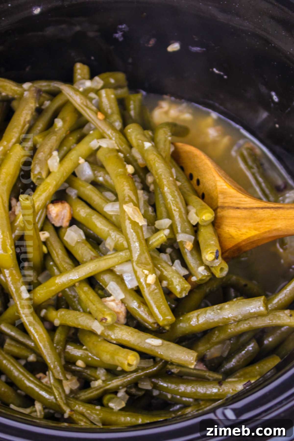 Delicious Crockpot Green Beans 12 Making green beans in the slow cooker with fresh ingredients.