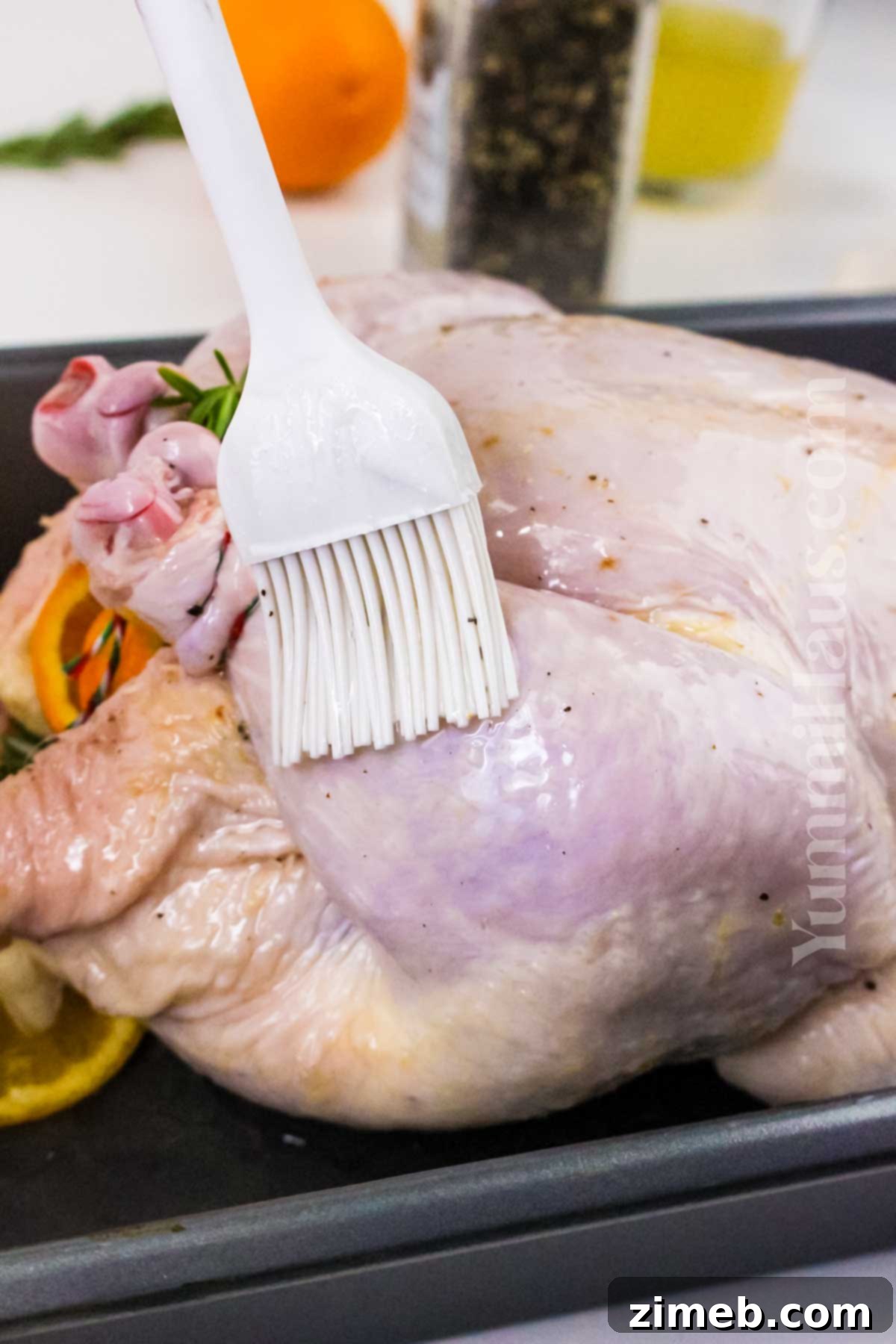 The Yuletide Bird 7 Prep the chicken before roasting, showing a raw chicken seasoned and ready for the oven.