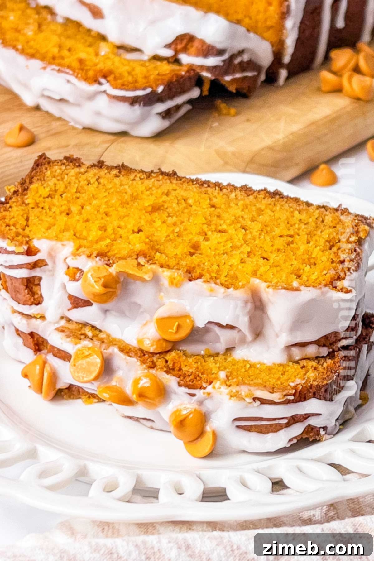 Sliced butterscotch bread with glaze, showing moist interior.