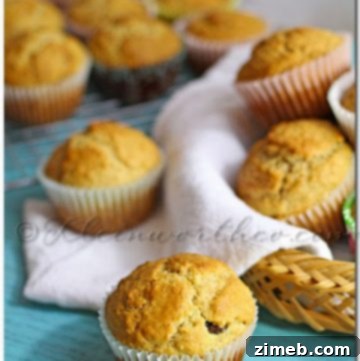Wholesome Lactose-Free Oat and Raisin Muffins 3 Close-up of freshly baked Oatmeal Raisin Muffins, showcasing their delightful texture and golden tops.