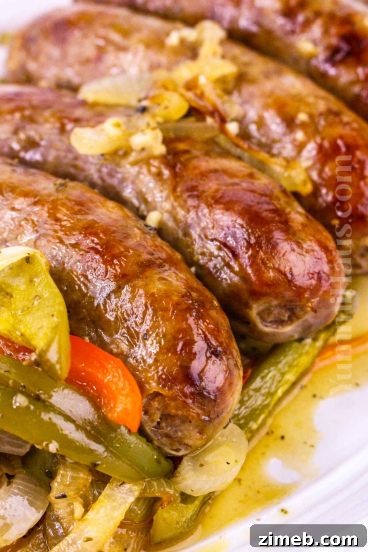 Final plated Baked Italian Sausage recipe with perfectly cooked sausages and roasted vegetables.