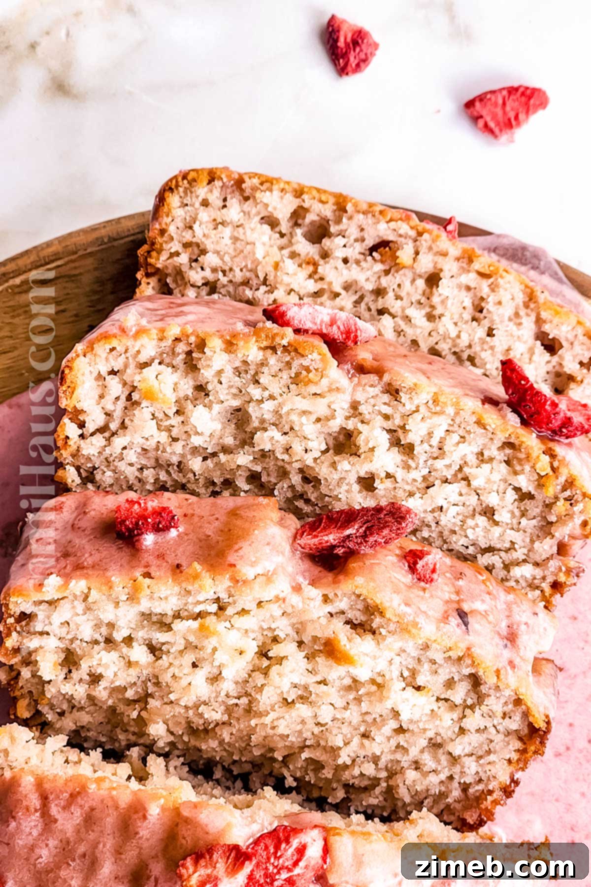 Sweet quick bread recipe with mixed berries and a delicate glaze, ready to serve.