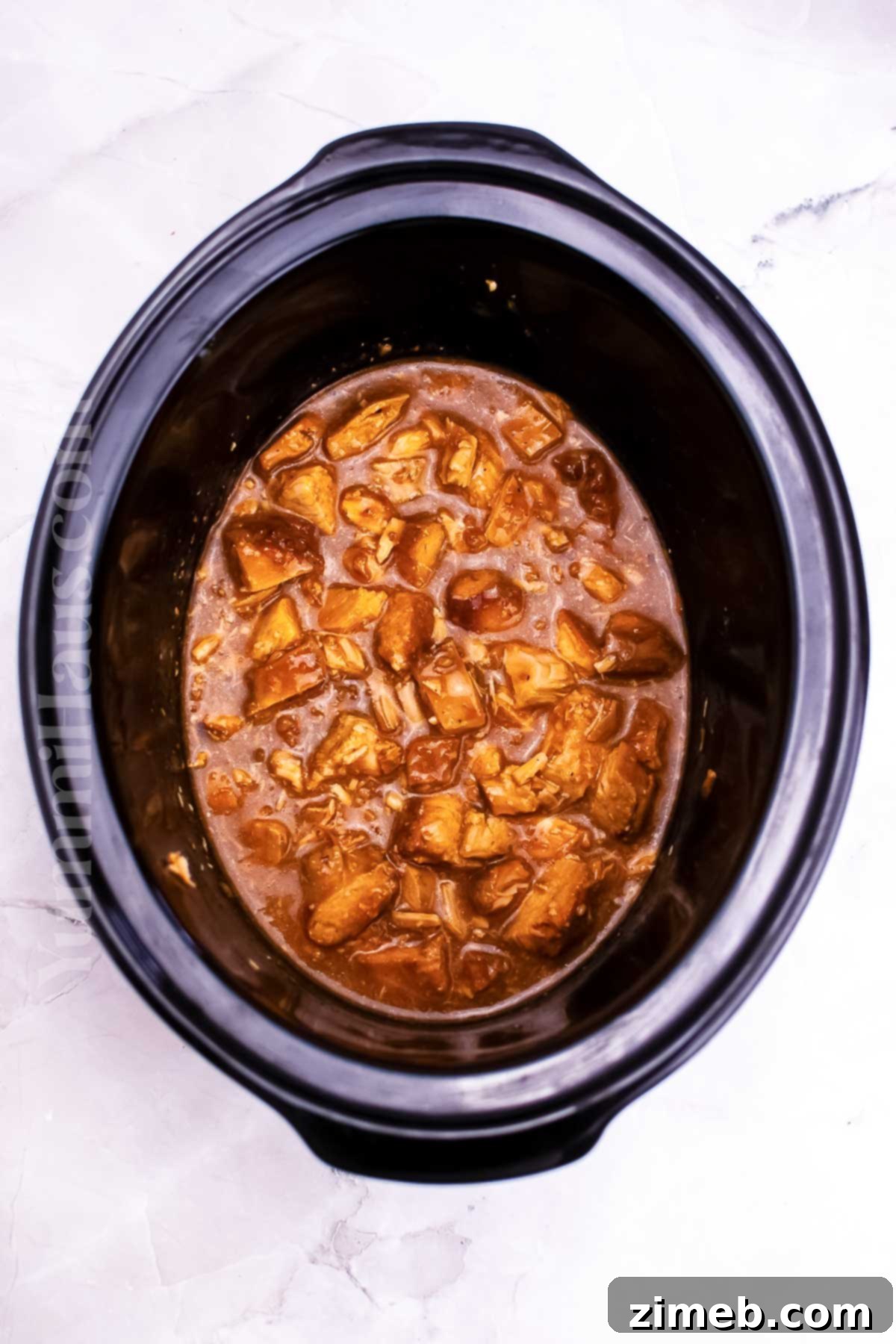 Zesty Orange Slow Cooker Chicken 7 Crockpot Orange Chicken served with rice and green onions