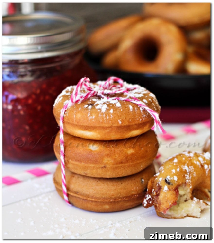 A stack of freshly baked Raspberry Chocolate Chip Donuts ready to be enjoyed.