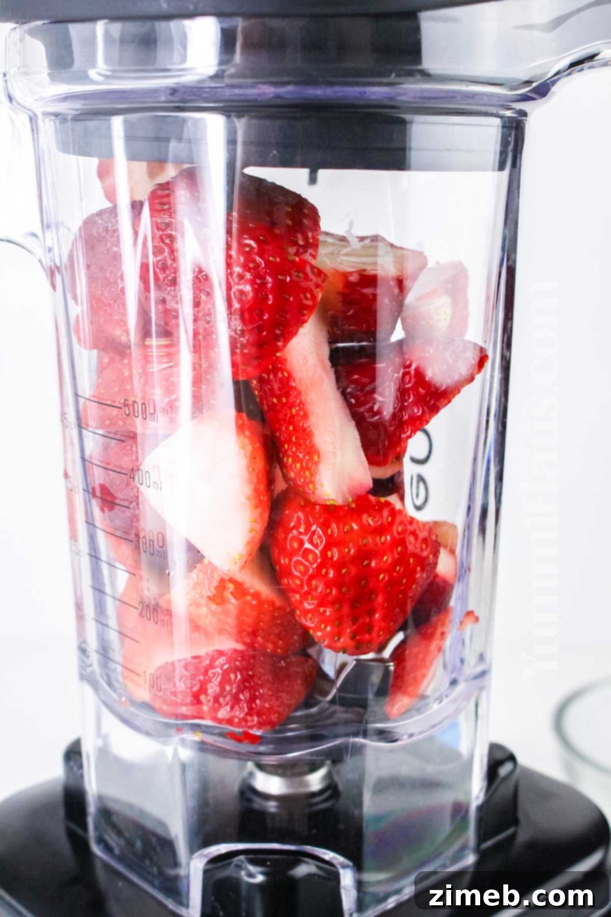 Blending the strawberries for strawberry mousse.