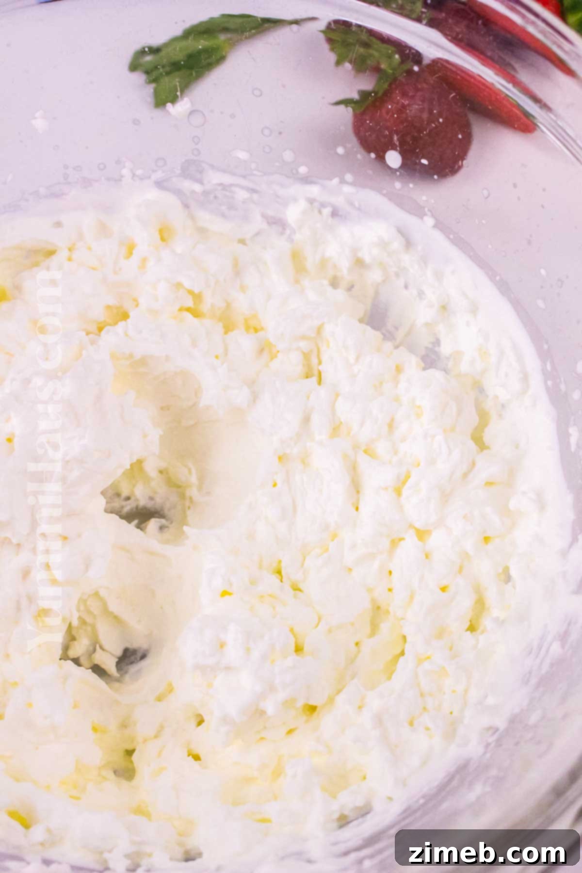 Freshly whipped cream in a bowl.